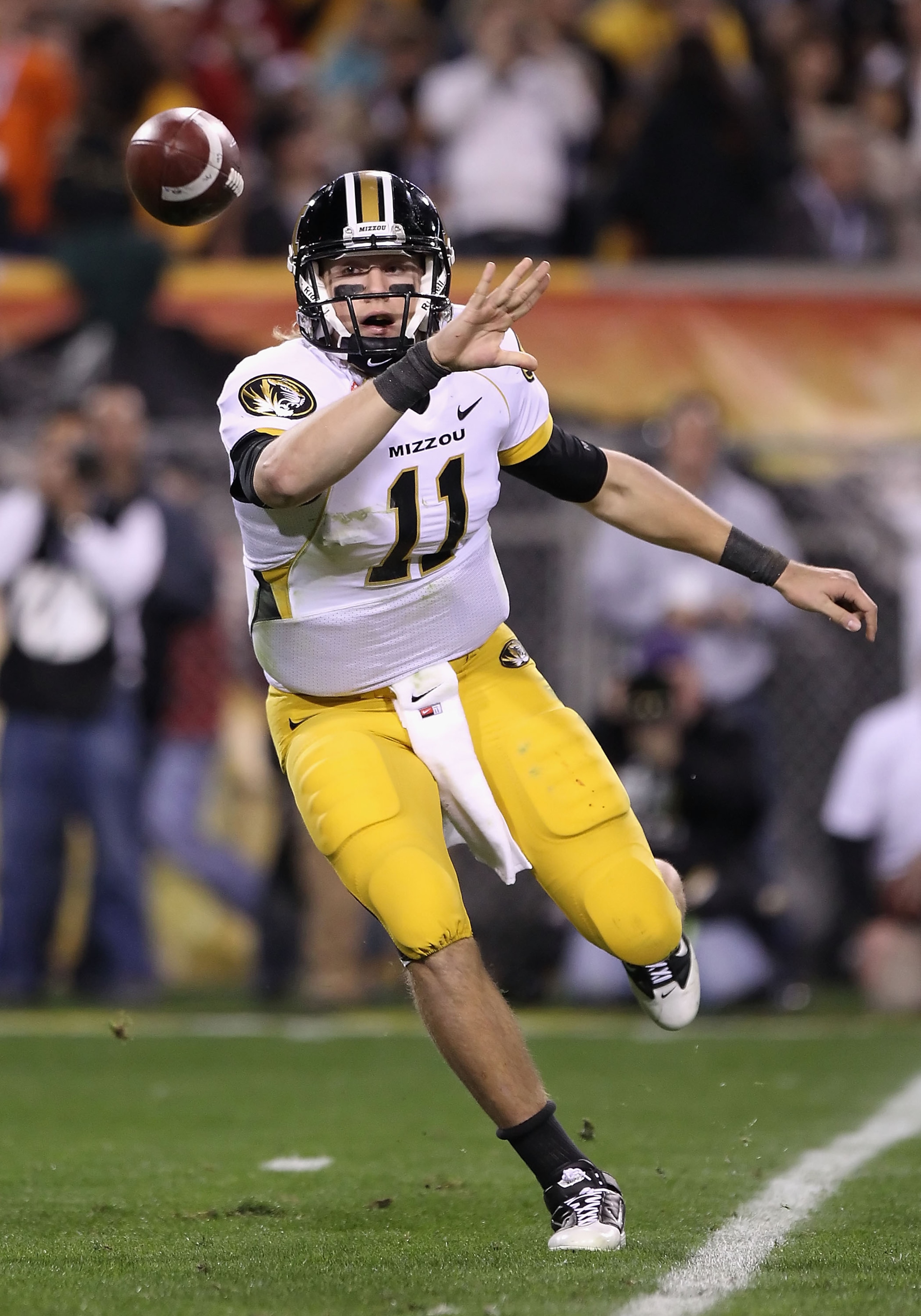 TEMPE, AZ - DECEMBER 28:  Quarterback Blaine Gabbert #11 of the Missouri Tigers flips the ball during the Insight Bowl against the Iowa Hawkeyes at Sun Devil Stadium on December 28, 2010 in Tempe, Arizona.  (Photo by Christian Petersen/Getty Images)