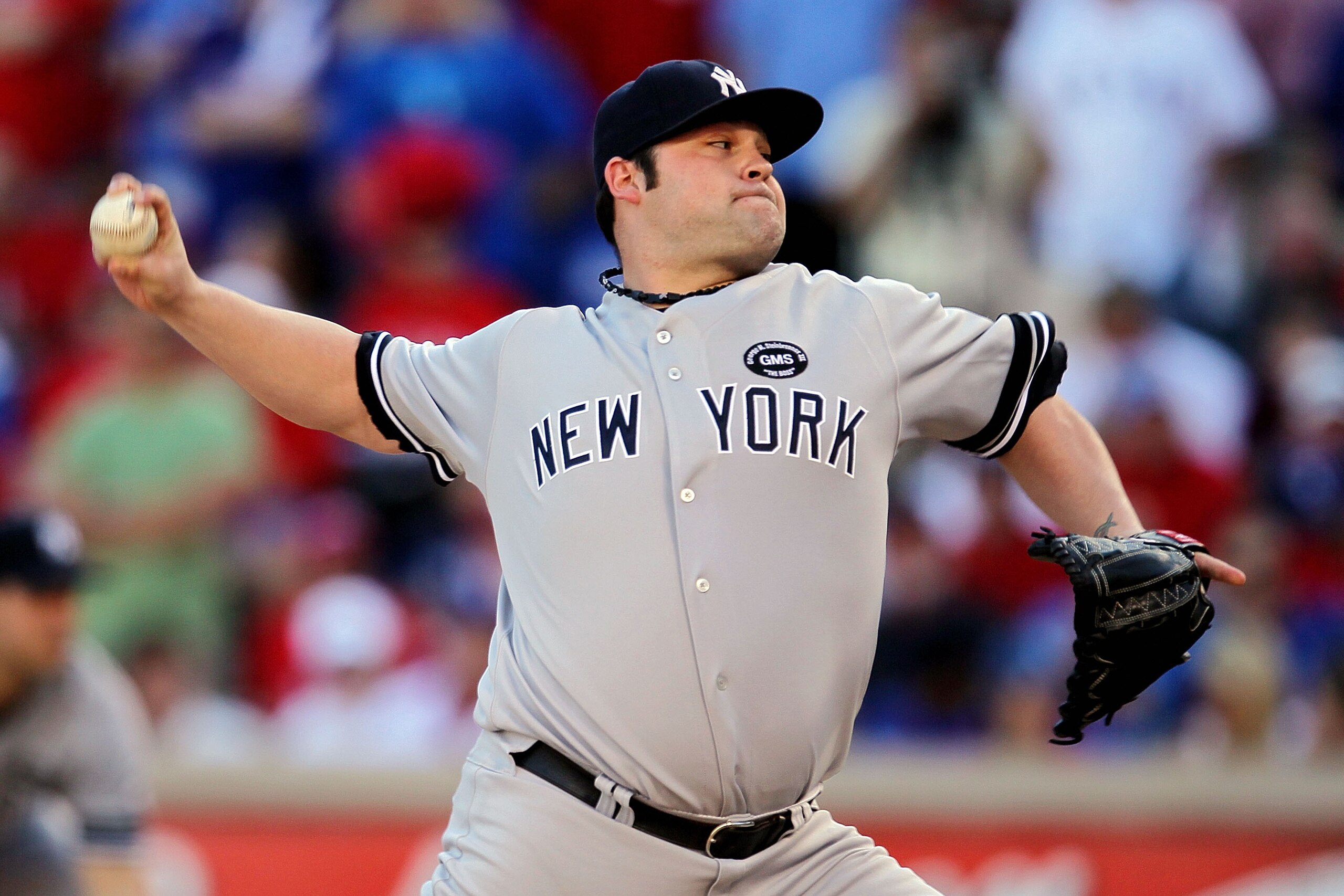 ARLINGTON, TX - OCTOBER 16:  Joba Chamberlain #62 of the New York Yankees throws a pitch against the Texas Rangers in Game Two of the ALCS during the 2010 MLB Playoffs at Rangers Ballpark in Arlington on October 16, 2010 in Arlington, Texas.  (Photo by St