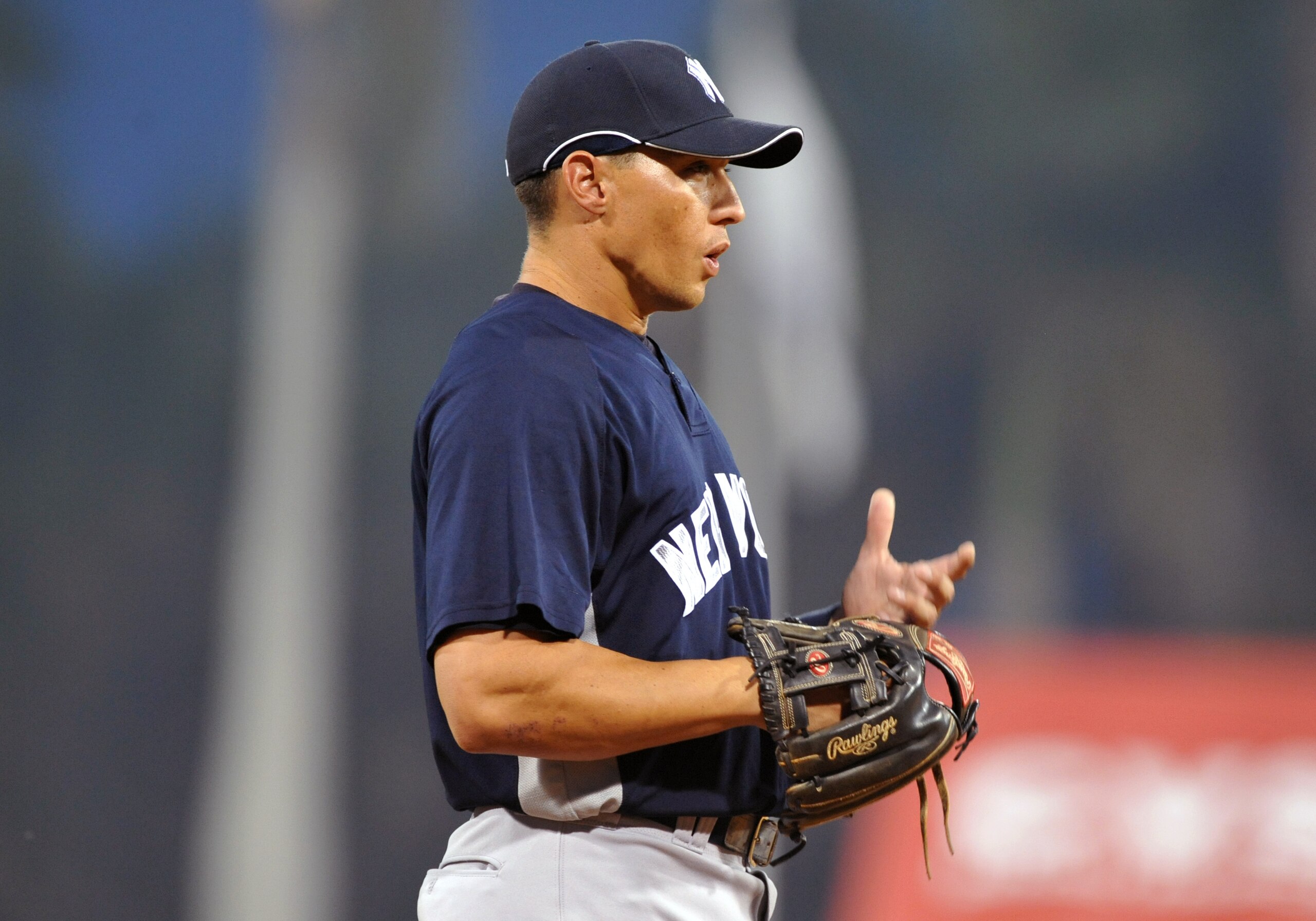FORT MYERS, FL - MARCH 13:  Infielder Cody Ransom #12 of the New York Yankees sets fat third base against the Boston Red Sox March 13, 2009 at City of Palms Park in Fort Myers, Florida.  (Photo by Al Messerschmidt/Getty Images)