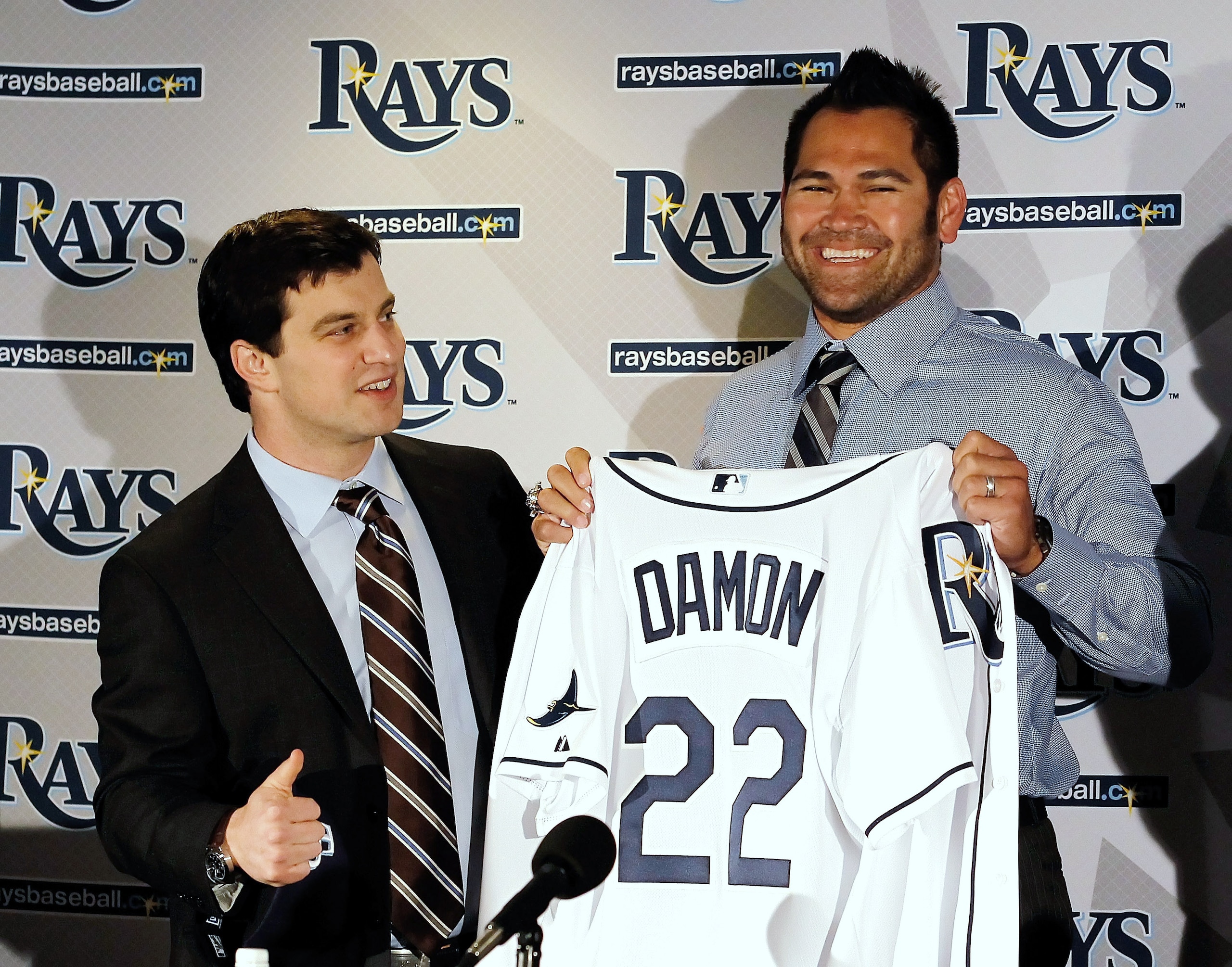 ST PETERSBURG, FL - FEBRUARY 01:  Executive Vice President of Baseball Operations Andrew Friedma (L) poses with Johnny Damon #22 of the Tampa bay Rays during a press conference at Tropicana Field on February 1, 2011 in St Petersburg, Florida.  (Photo by J