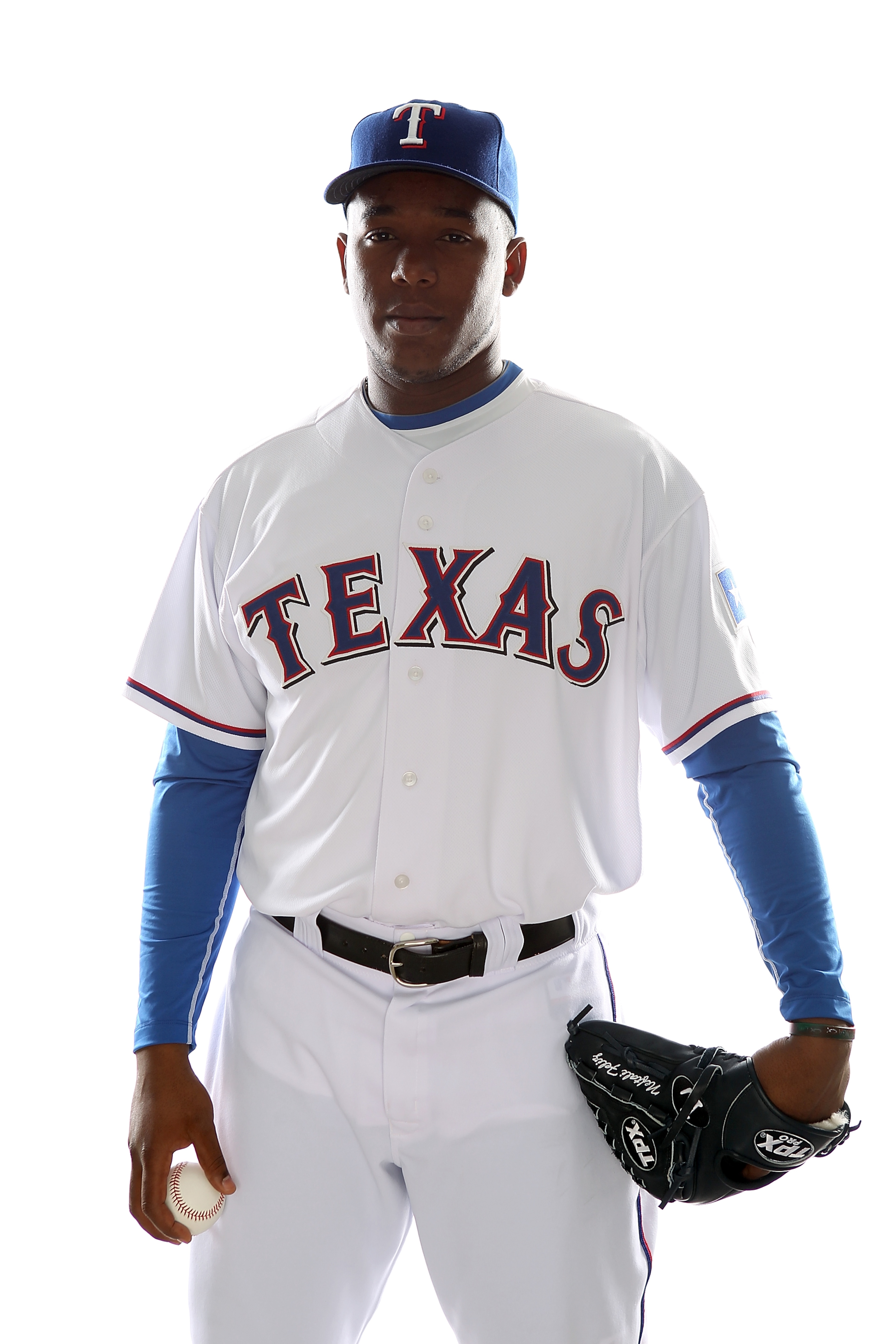 SURPRISE, AZ - FEBRUARY 25:  Neftali Feliz #30 of the Texas Rangers poses for a portrait during Spring Training Media Day on February 25, 2011 at Surprise Stadium in Surprise, Arizona.  (Photo by Jonathan Ferrey/Getty Images)