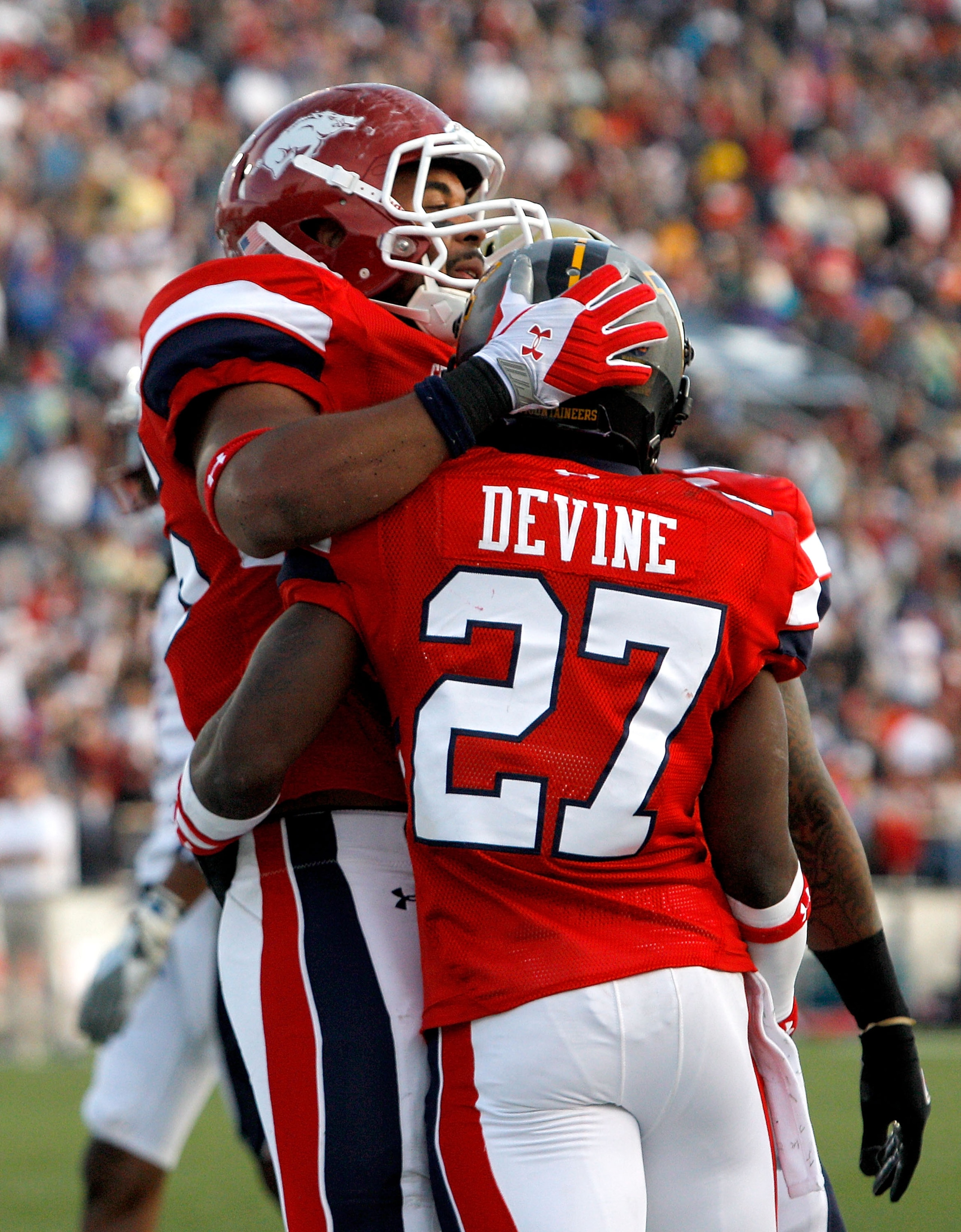 MOBILE, AL - JANUARY 29:  Running back Noel Devine #27 of the South team celebrates with tight end  D. J. Williams #45 after scoring a touchdown during the second quarter of the Under Armour Senior Bowl on January 29, 2011 at Ladd-Pebbles Stadium in Mobil