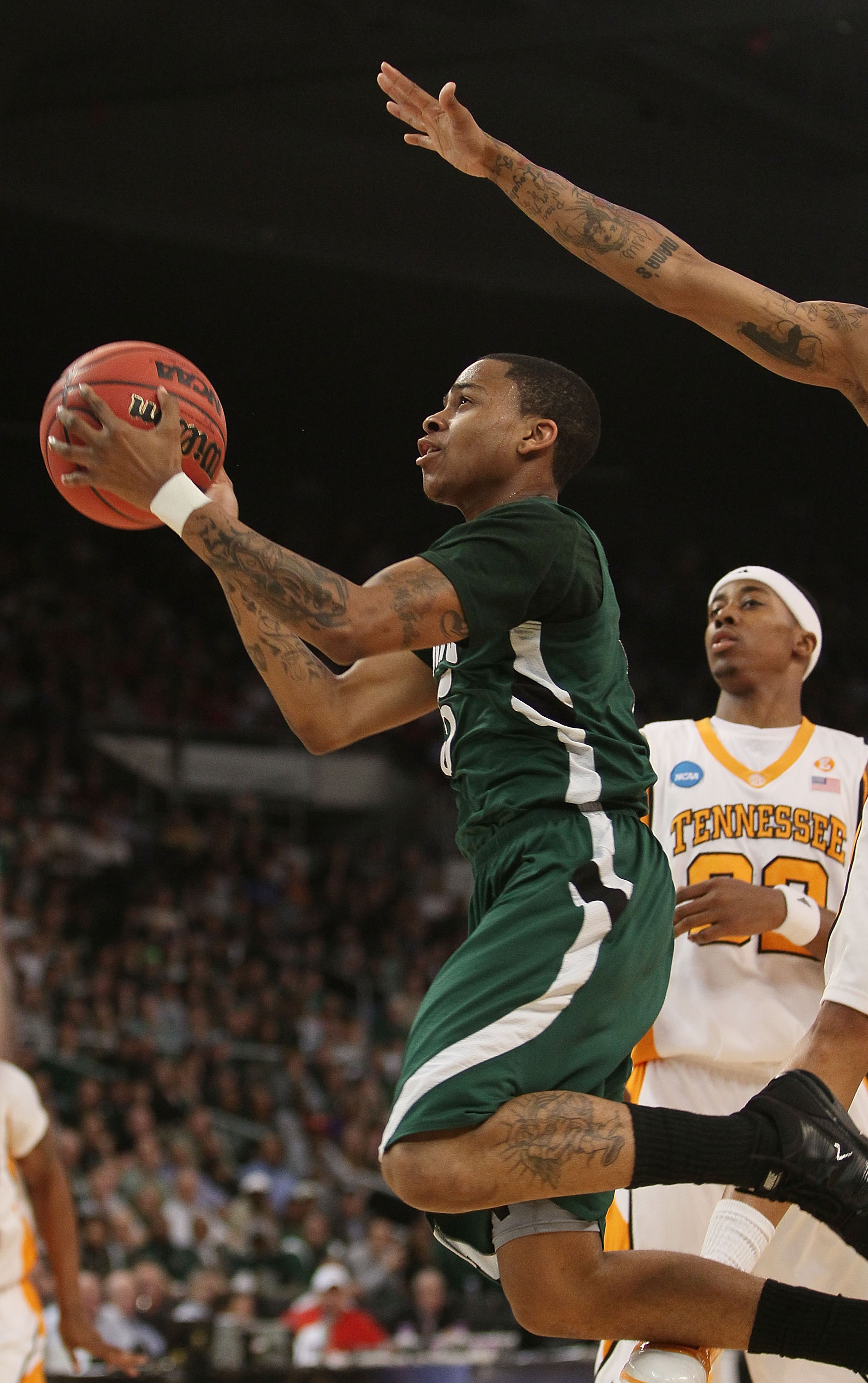 PROVIDENCE, RI - MARCH 20: D.J. Cooper #5 of the Ohio Bobcats heads for the net as Scotty Hopson #32 of the Tennessee Volunteers defends during the second round of the 2010 NCAA men's basketball tournament on March 20, 2010 at the Dunkin Donuts Center in