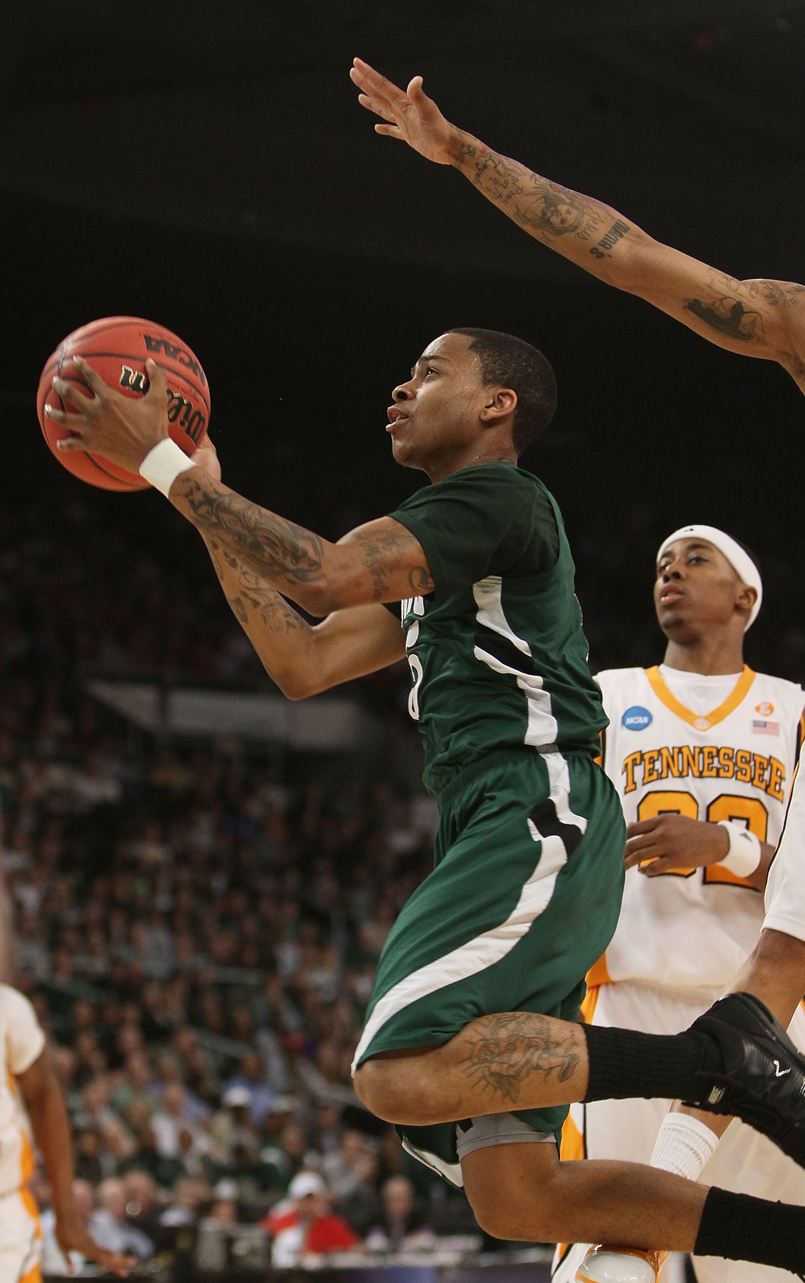 PROVIDENCE, RI - MARCH 20:  D.J. Cooper #5 of the Ohio Bobcats heads for the net as Scotty Hopson #32 of the Tennessee Volunteers defends during the second round of the 2010 NCAA men's basketball tournament on March 20, 2010 at the Dunkin Donuts Center in