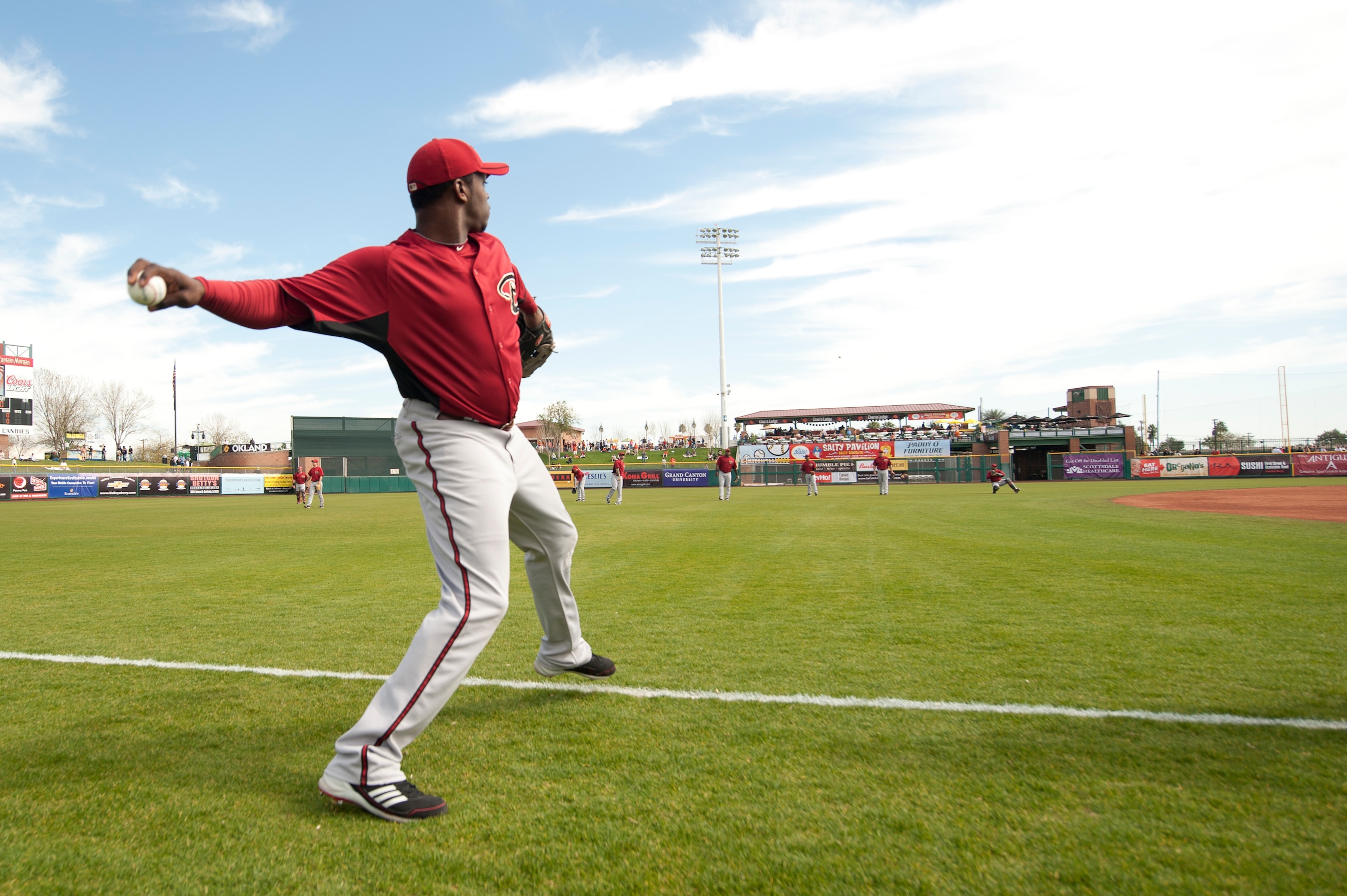 SCOTTSDALE, AZ - FEBRUARY 25: Justin Upton #10 of the Arizona Diamondbacks warms up throwing before a spring training game San Francisco Giant at Scottsdale Stadium on February 25, 2011 in Scottsdale, Arizona. (Photo by Rob Tringali/Getty Images)