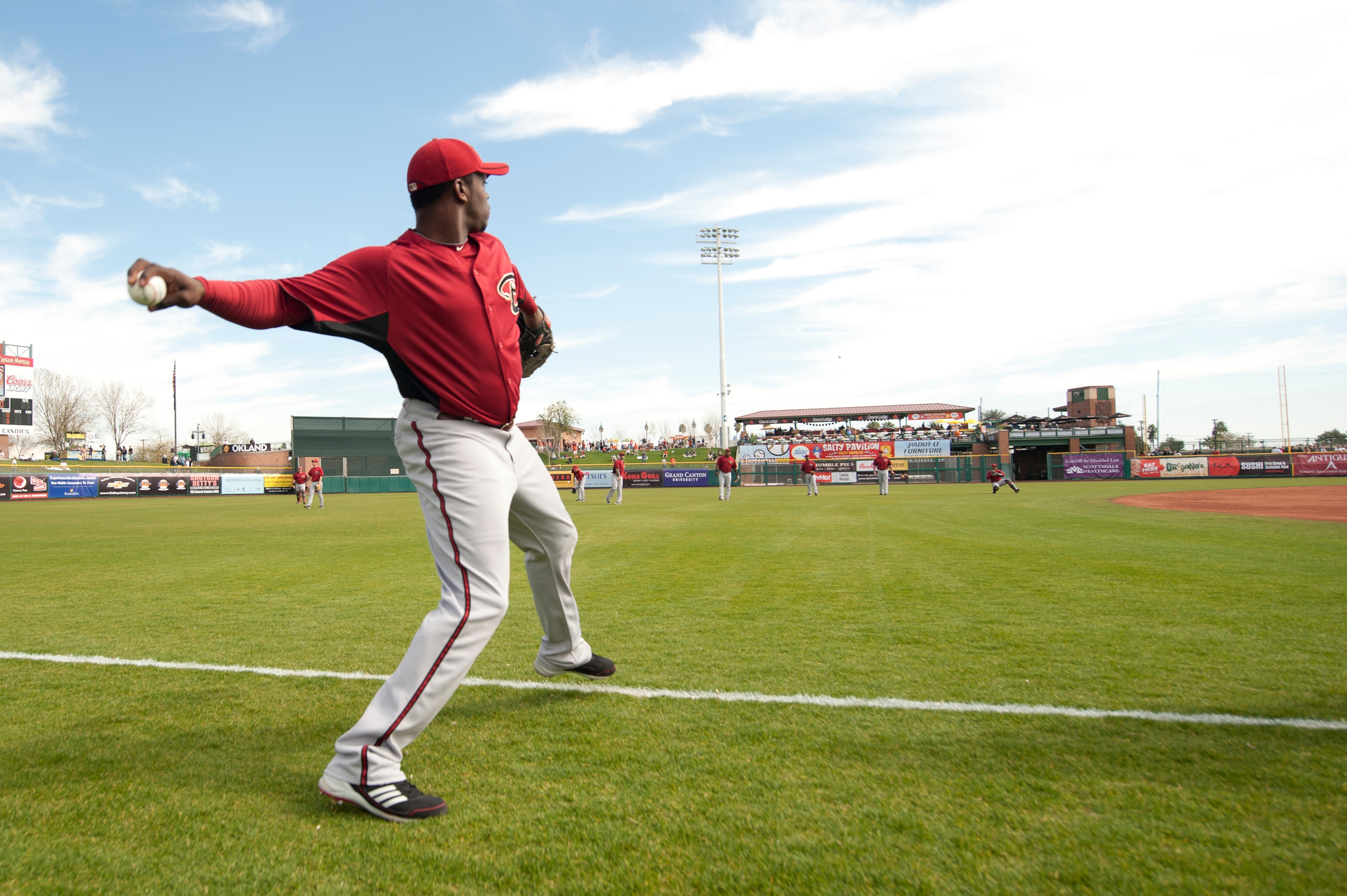 SCOTTSDALE, AZ - FEBRUARY 25: Justin Upton #10 of the Arizona Diamondbacks warms up throwing before a spring training game San Francisco Giant at Scottsdale Stadium on February 25, 2011 in Scottsdale, Arizona. (Photo by Rob Tringali/Getty Images)