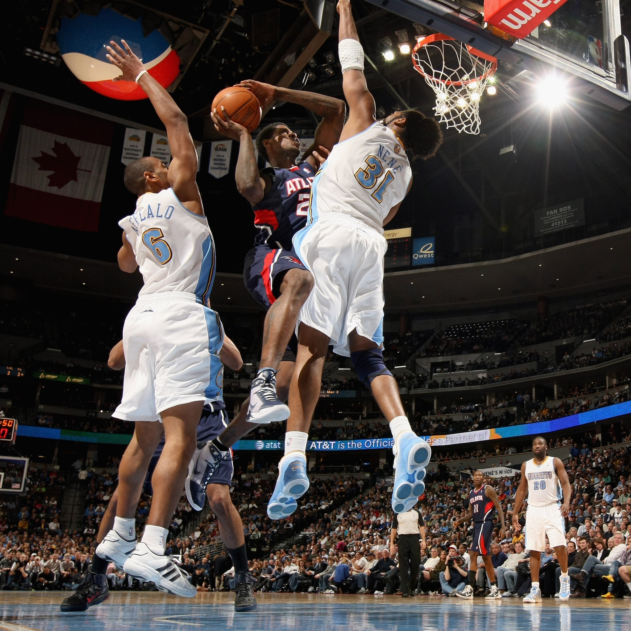 DENVER, CO - FEBRUARY 28:  Marvin Williams #24 of the Atlanta Hawks is fouled by Nene #31 of the Denver Nuggets as Arron Afflalo #6 helps defend during NBA action at the Pepsi Center on February 28, 2011 in Denver, Colorado. The Nuggets deafeated the Hawk
