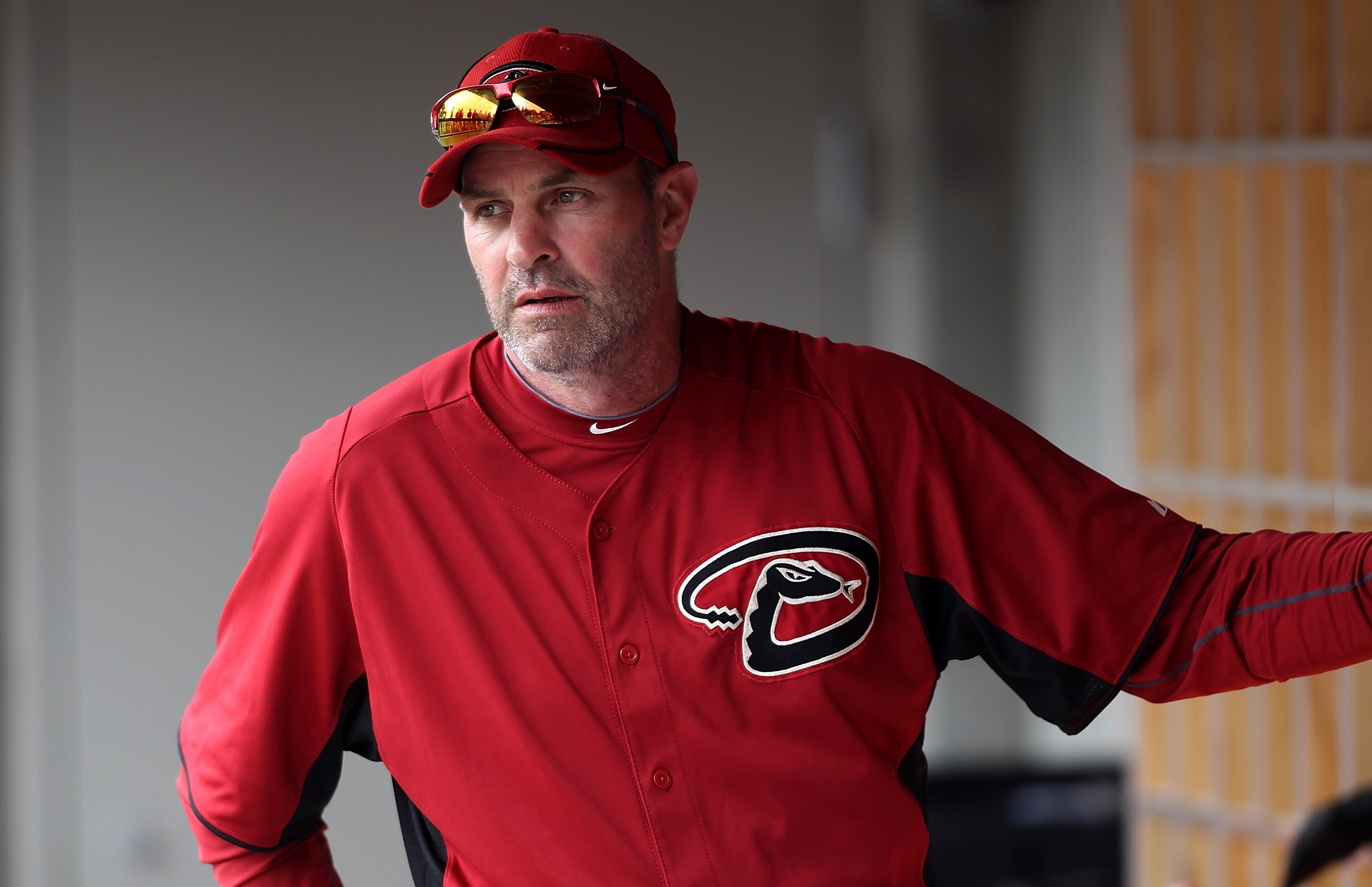 SCOTTSDALE, AZ - FEBRUARY 26:  Manager Kirk Gibson #23 of the Arizona Diamondbacks sits in the dugout during a game against the Colorado Rockies at Salt River Fields on February 26, 2011 in Scottsdale, Arizona..  (Photo by Jonathan Ferrey/Getty Images)