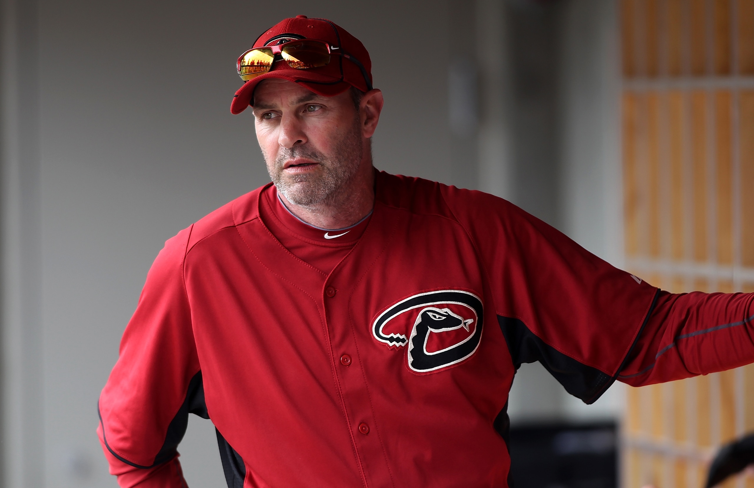 SCOTTSDALE, AZ - FEBRUARY 26:  Manager Kirk Gibson #23 of the Arizona Diamondbacks sits in the dugout during a game against the Colorado Rockies at Salt River Fields on February 26, 2011 in Scottsdale, Arizona..  (Photo by Jonathan Ferrey/Getty Images)