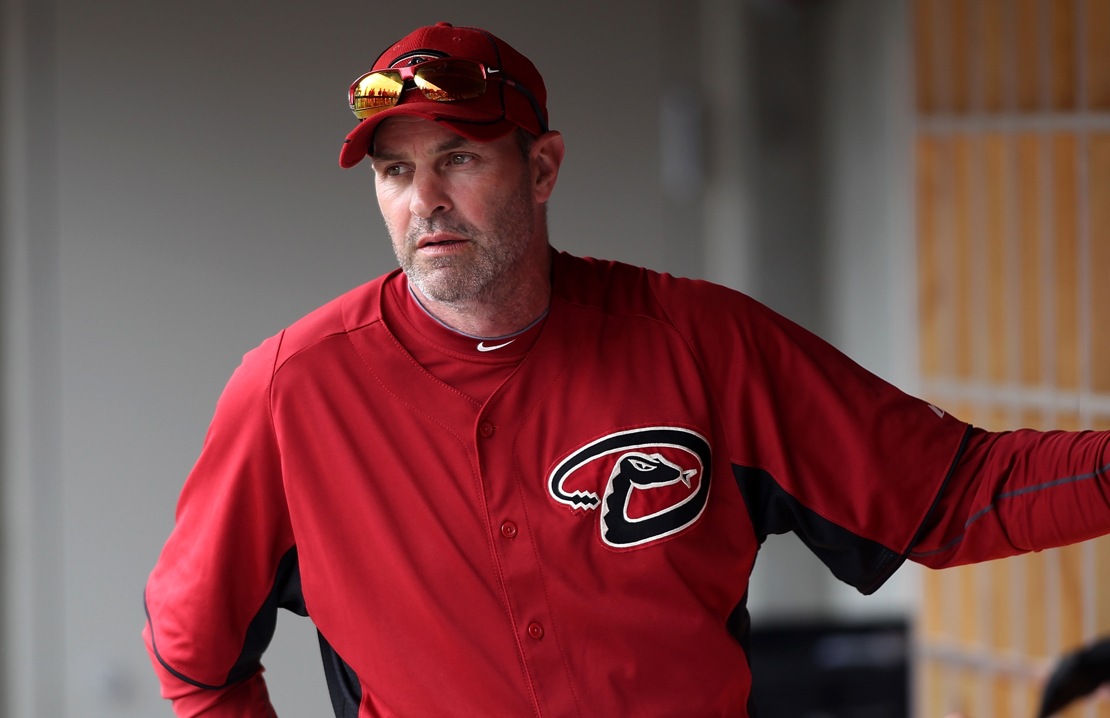 SCOTTSDALE, AZ - FEBRUARY 26:  Manager Kirk Gibson #23 of the Arizona Diamondbacks sits in the dugout during a game against the Colorado Rockies at Salt River Fields on February 26, 2011 in Scottsdale, Arizona..  (Photo by Jonathan Ferrey/Getty Images)