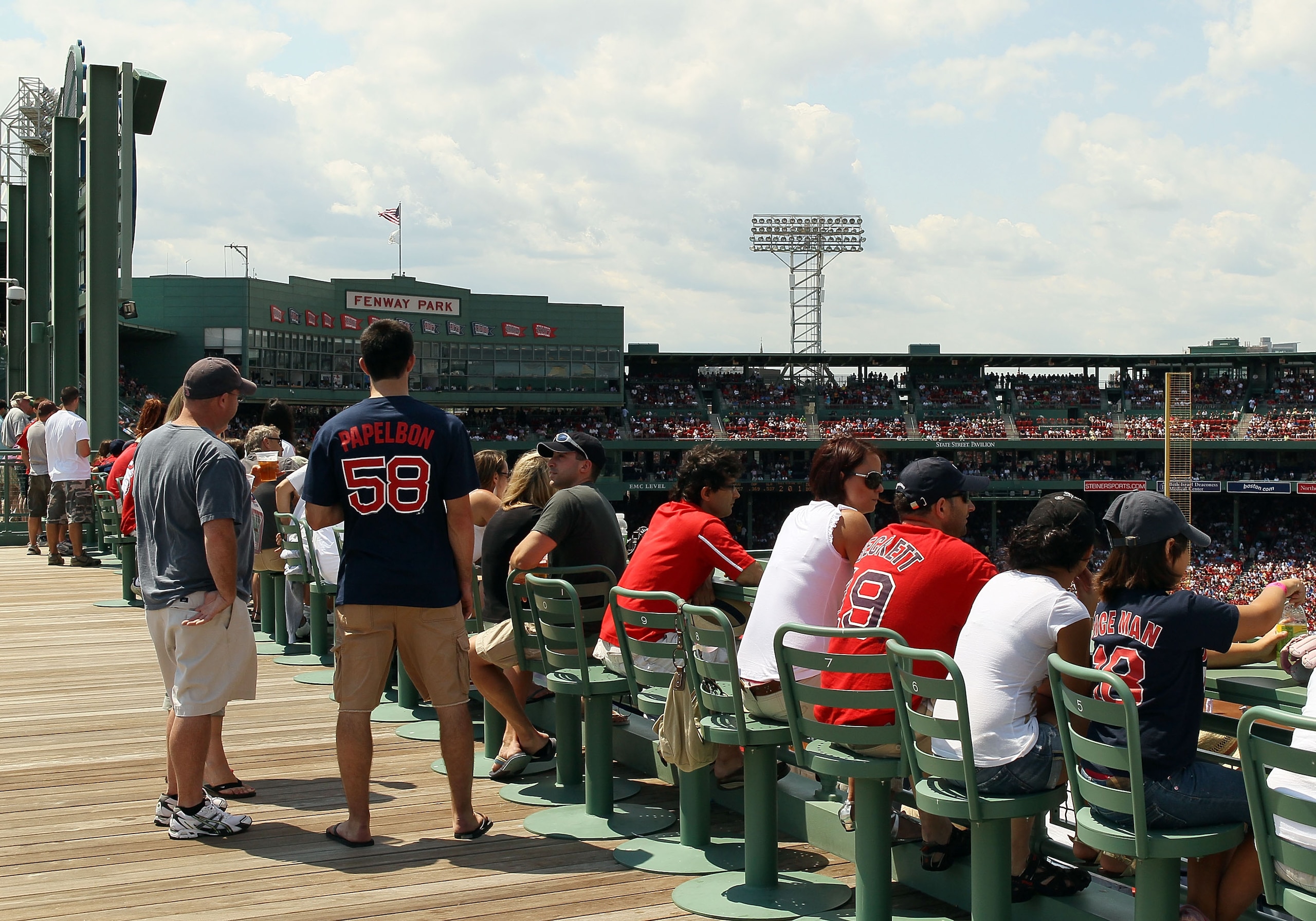 BOSTON - AUGUST 01:  Fans enjoy the game from the right field deck as the Boston Red Sox take on the Detroit Tigers on August 1, 2010 at Fenway Park in Boston, Massachusetts.  (Photo by Elsa/Getty Images)