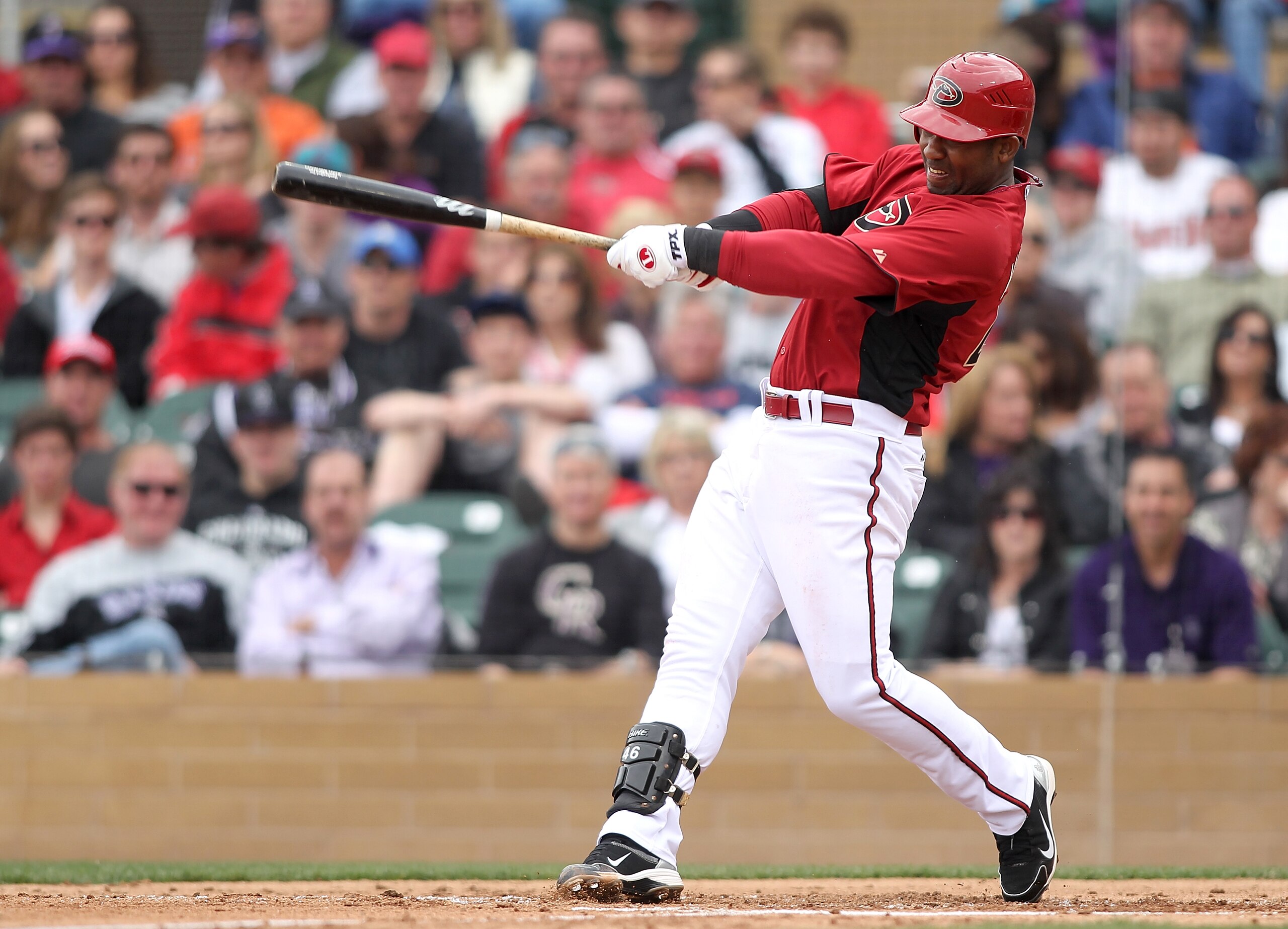 SCOTTSDALE, AZ - FEBRUARY 26:  Juan Miranda #46 of the Arizona Diamondbacks swings his bat against the Colorado Rockies at Salt River Fields on February 26, 2011 in Scottsdale, Arizona..  (Photo by Jonathan Ferrey/Getty Images)