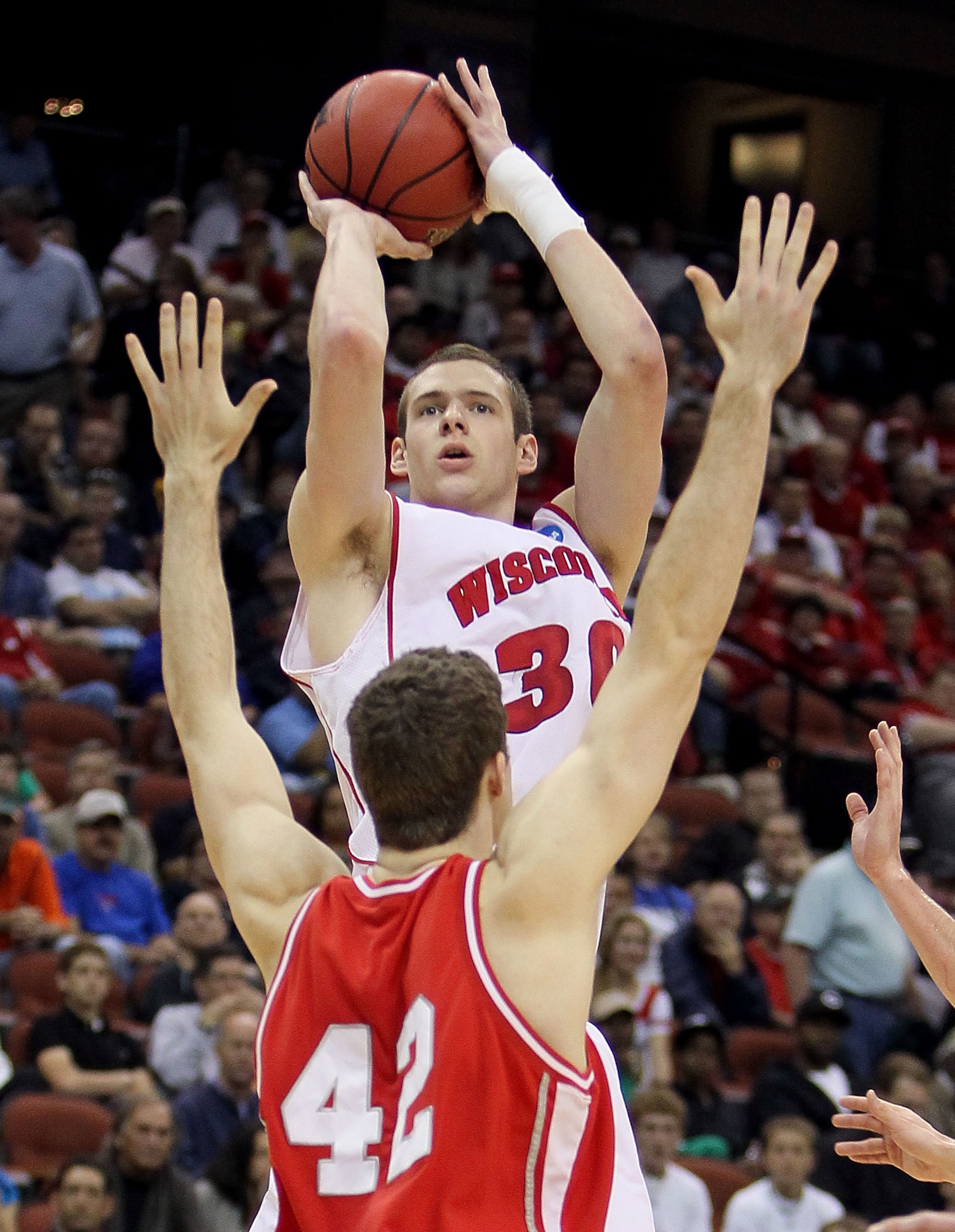 JACKSONVILLE, FL - MARCH 21:  Jon Leuer #30 of the Wisconsin Badgers shoots over Mark Coury #42 of the Cornell Big Red during the second round of the 2010 NCAA men's basketball tournament at Jacksonville Veteran's Memorial Arena on March 21, 2010 in Jacks