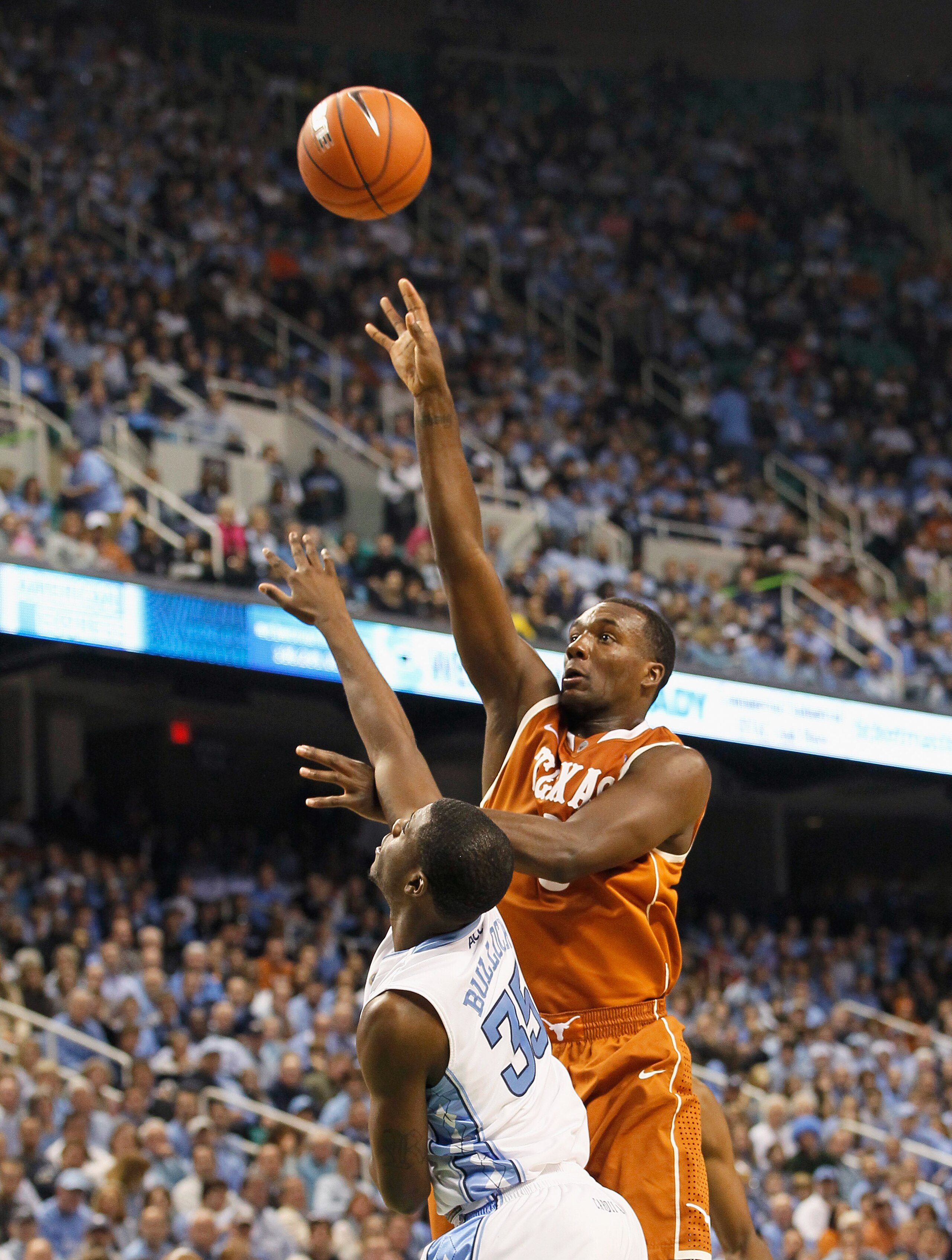 GREENSBORO, NC - DECEMBER 18:  Jordan Hamilton #3 of the Texas Longhorns against Reggie Bullock #35 of the North Carolina Tar Heels at Greensboro Coliseum on December 18, 2010 in Greensboro, North Carolina.  (Photo by Kevin C. Cox/Getty Images)