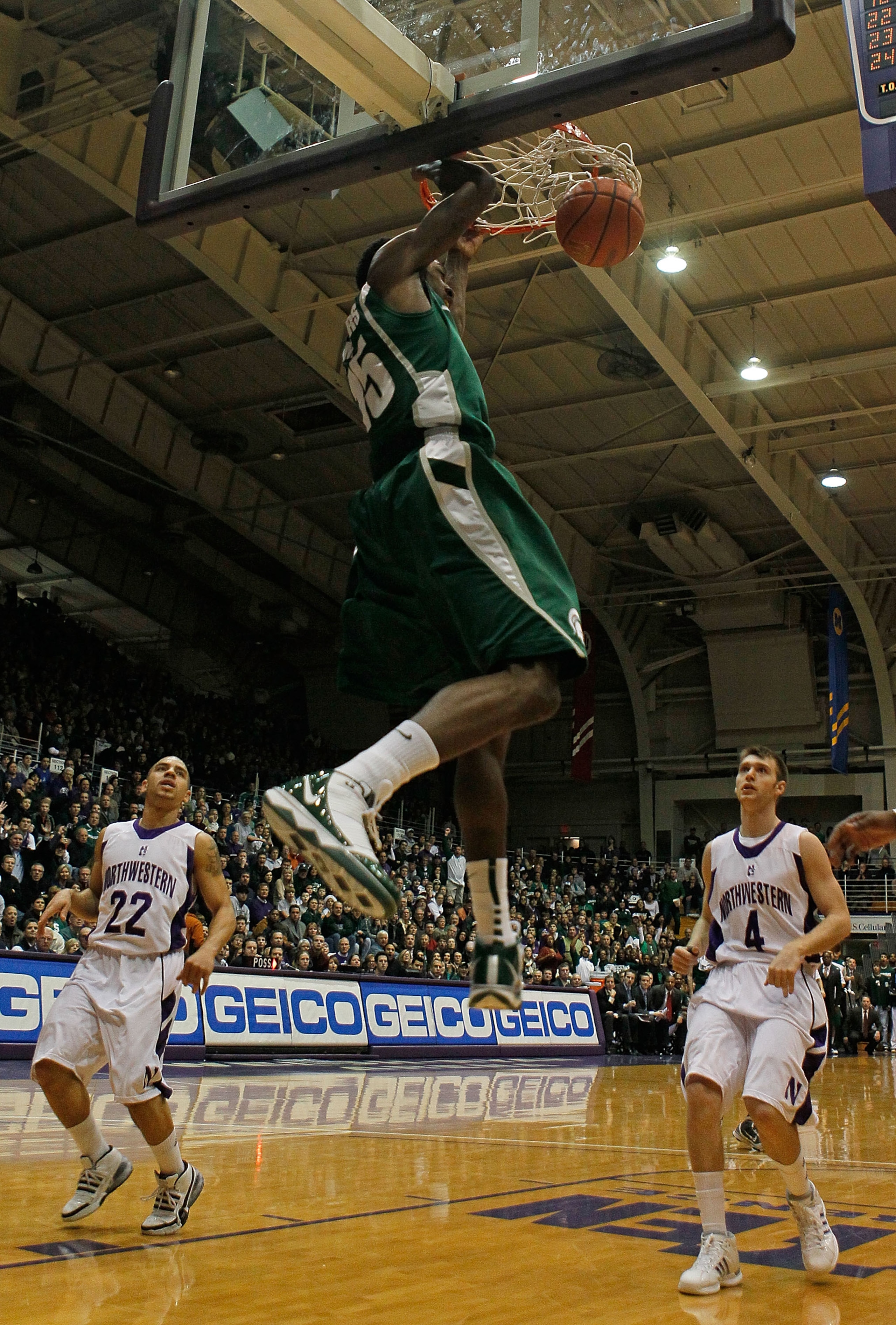 EVANSTON, IL - JANUARY 02: Durrell Summers #15 of the Michigan State Spartans dunks the ball against Michael Thompson #22 and Alex Marcotullio #4 of the Northwestern Wildcats on January 2, 2010 at Welsh-Ryan Arena in Evanston, Illinois. (Photo by Jonathan EVANSTON, IL - JANUARY 02: Durrell Summers #15 of the Michigan State Spartans dunks the ball against Michael Thompson #22 and Alex Marcotullio #4 of the Northwestern Wildcats on January 2, 2010 at Welsh-Ryan Arena in Evanston, Illinois. (Photo by Jonathan