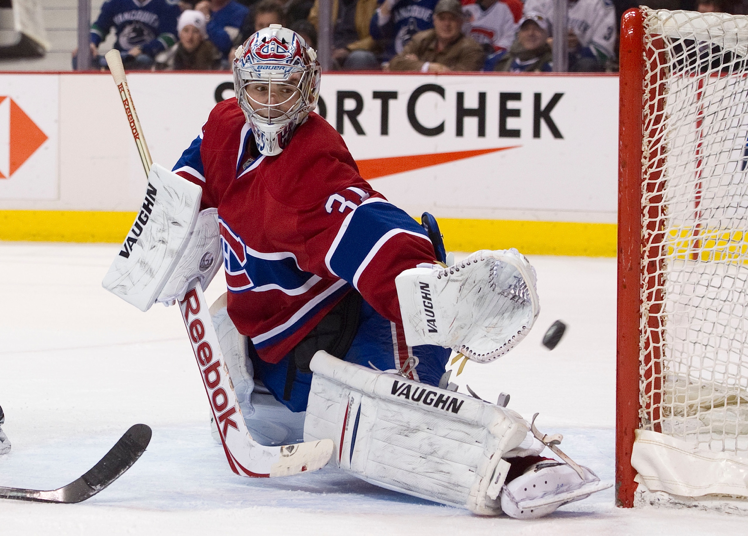 VANCOUVER, CANADA - FEBRUARY 22: Goalie Carey Price #31 of the Montreal Canadiens reaches out and watches a Vancouver Canucks shot go wide of the net during the second period in NHL action on February 22, 2011 at Rogers Arena in Vancouver, British Columbi