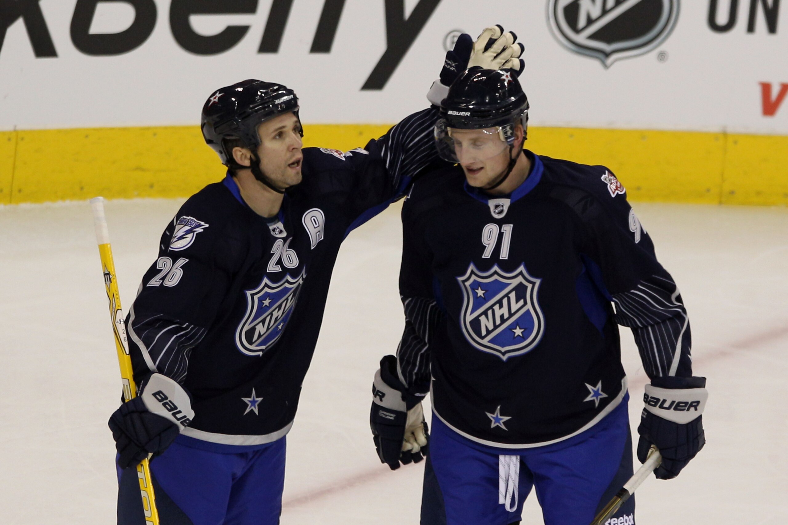 RALEIGH, NC - JANUARY 30:  Martin St. Louis #26 of the Tampa Bay Lightning and Steven Stamkos #91 of the Tampa Bay Lightning both playing for Team Lidstrom celebrate against Team Staal in the 58th NHL All-Star Game at RBC Center on January 30, 2011 in Ral