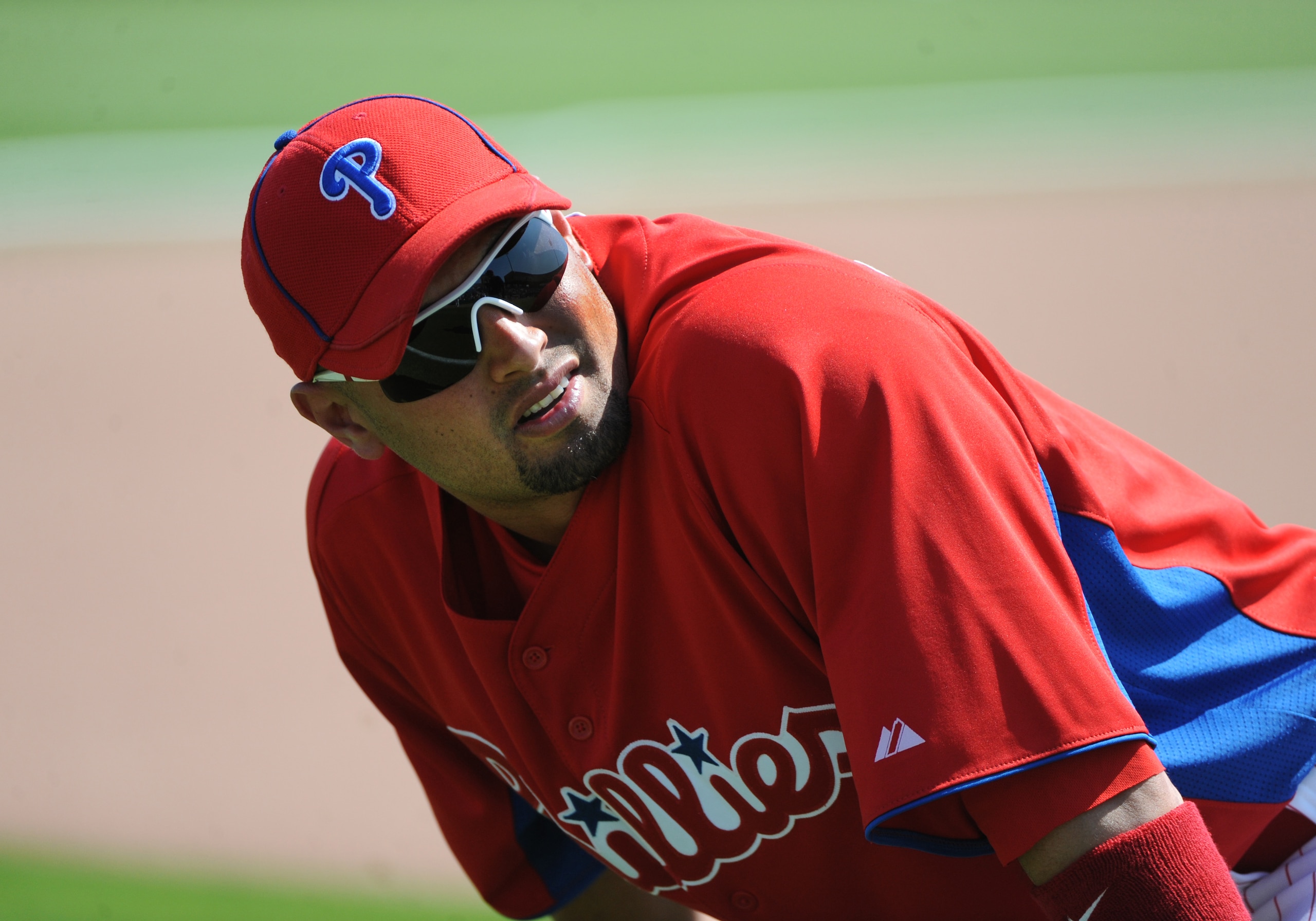 CLEARWATER, FL - FEBRUARY 24:  Outfielder Shane Victorino #8 of the Philadelphia Phillies stretches before play against the Florida State Seminoles February 24, 2011 at Bright House Field in Clearwater, Florida.  (Photo by Al Messerschmidt/Getty Images)