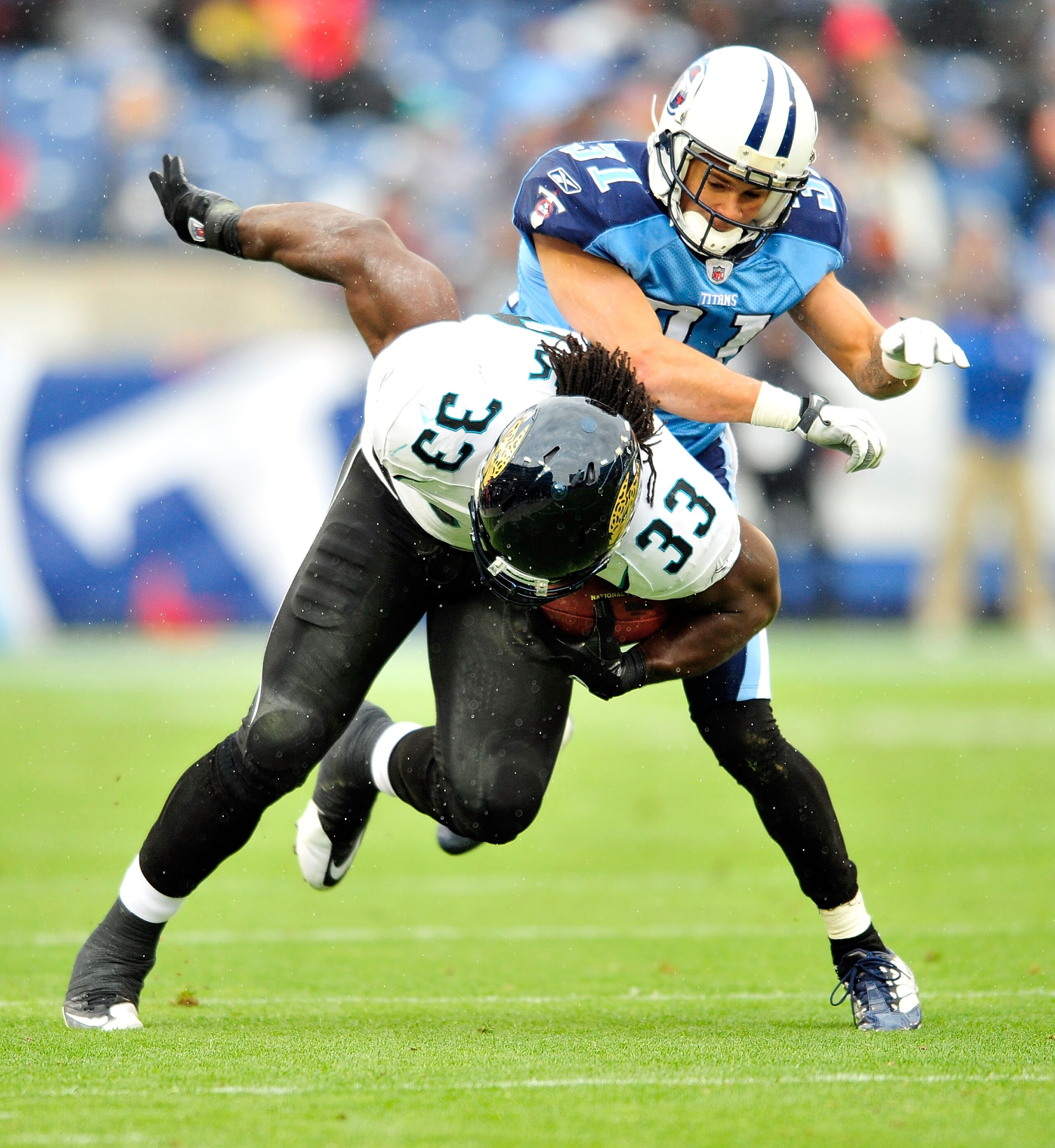 NASHVILLE, TN - DECEMBER 05:  Courtland Finnegan #31 of the Tennessee Titans tackles Maurice Jones-Drew #32 of the Jacksonville Jaguars during the first half at LP Field on December 5, 2010 in Nashville, Tennessee.  (Photo by Grant Halverson/Getty Images)
