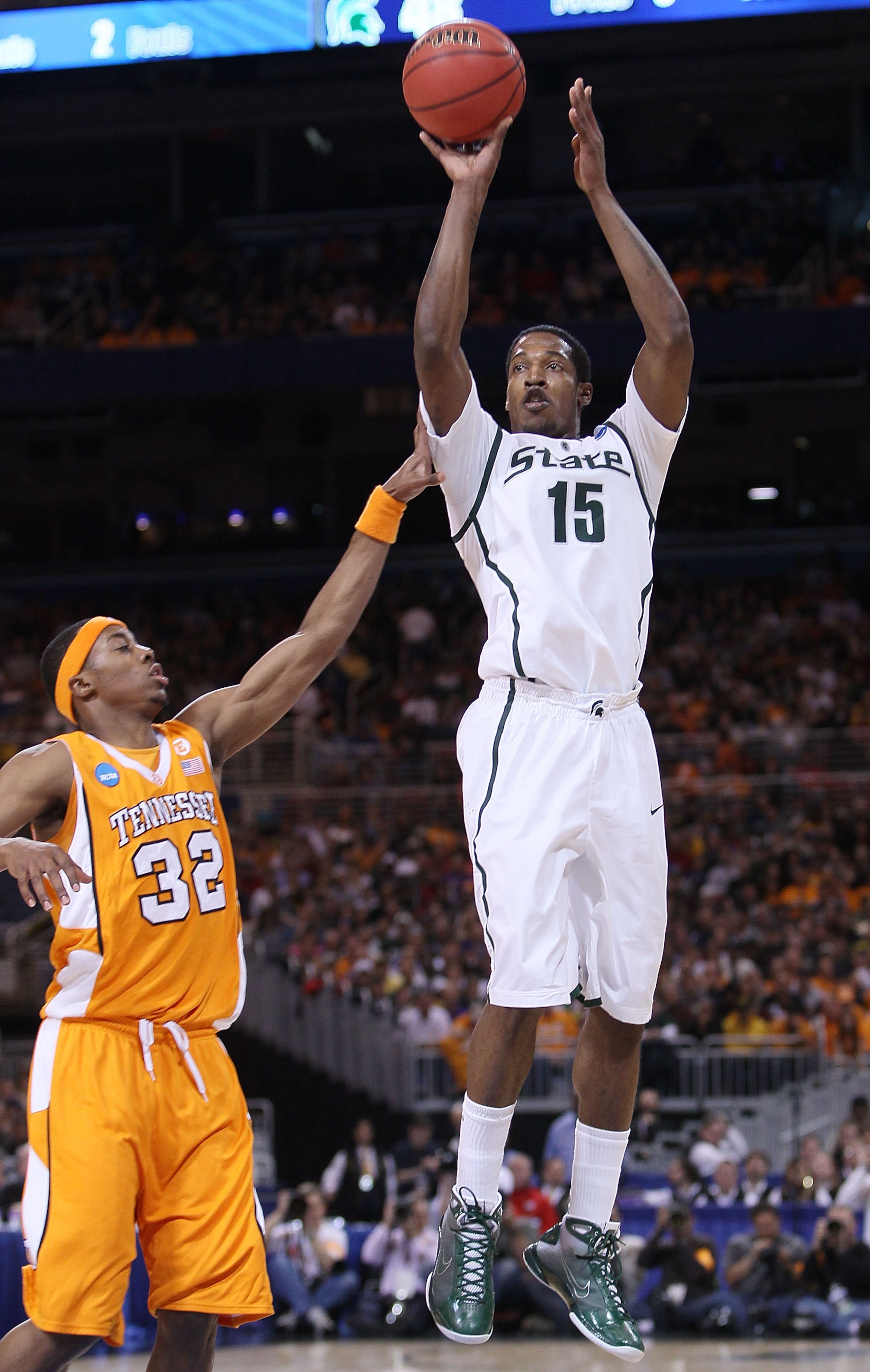 ST. LOUIS - MARCH 28: Durrell Summers #15 of the Michigan State Spartans takes a shot as Scotty Hopson #32 of the Tennessee Volunteers defends during the midwest regional final of the 2010 NCAA men's basketball tournament at the Edward Jones Dome on Marc ST. LOUIS - MARCH 28: Durrell Summers #15 of the Michigan State Spartans takes a shot as Scotty Hopson #32 of the Tennessee Volunteers defends during the midwest regional final of the 2010 NCAA men's basketball tournament at the Edward Jones Dome on Marc