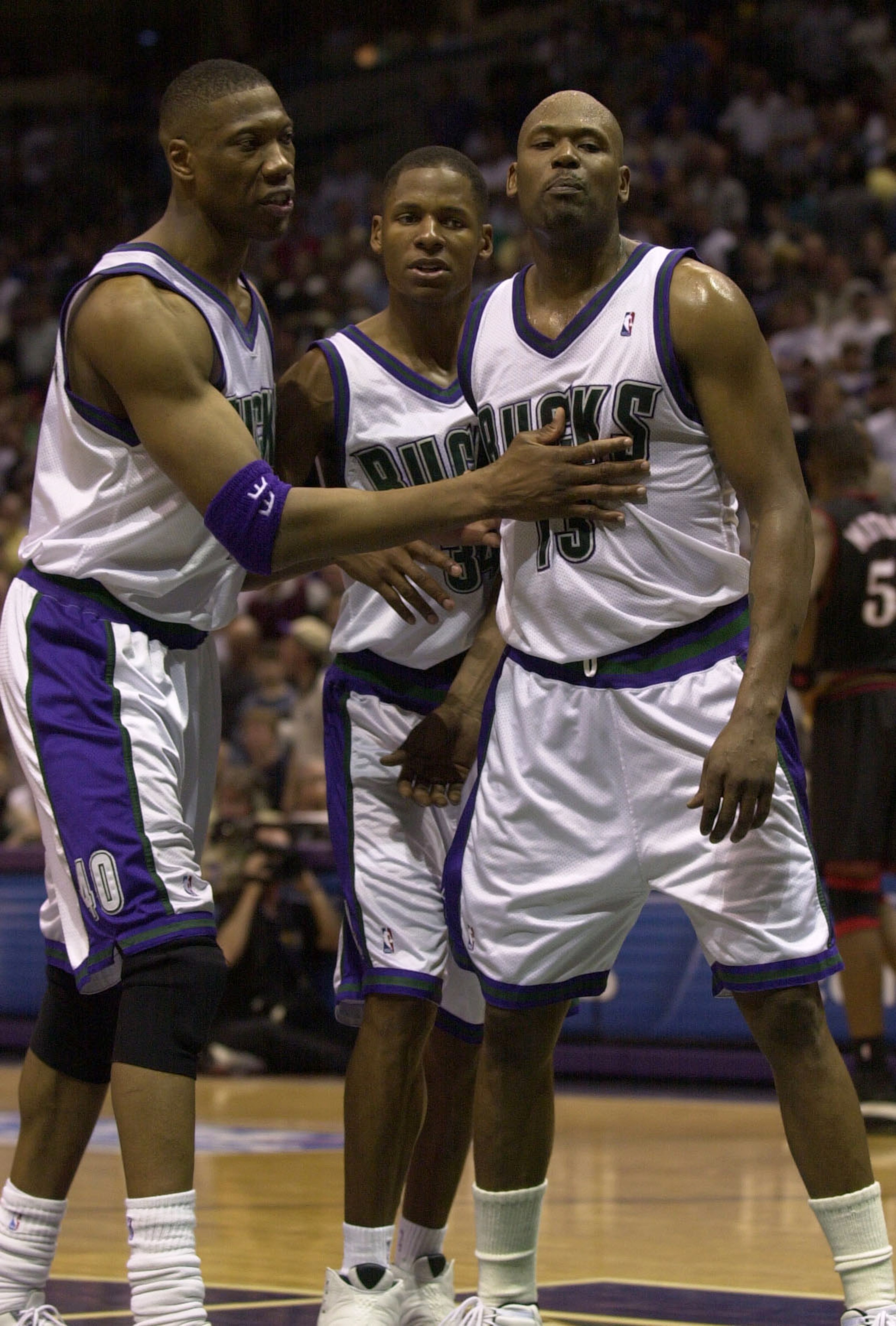 28 May 2001:  Glenn Robinson #13 of the Milwaukee Bucks,  right, is held back by teammates Ervin Johnson #40, left, and Ray Allen #34, center, after Robinson was ejected late in  game four of the NBA Eastern Conference Finals against the Philadelphia 76er