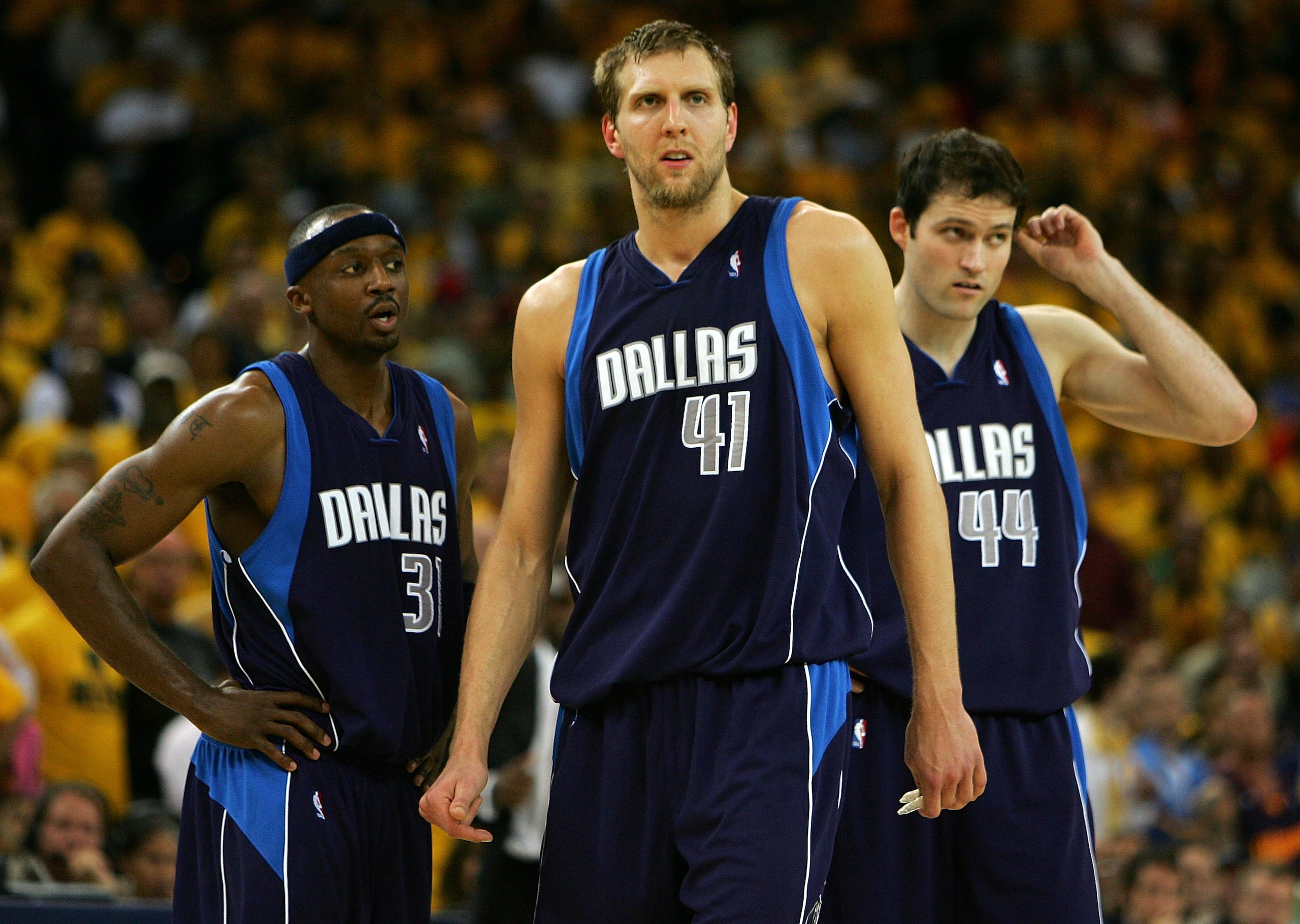 OAKLAND, CA - MAY 03:  Dirk Nowitizki #41, Jason Terry #31 and Austin Croshere #44 of the Dallas Mavericks look on against the Golden State Warriors in Game 6 of the Western Conference Quarterfinals during the 2007 NBA Playoffs on May 3, 2007 at Oracle Ar