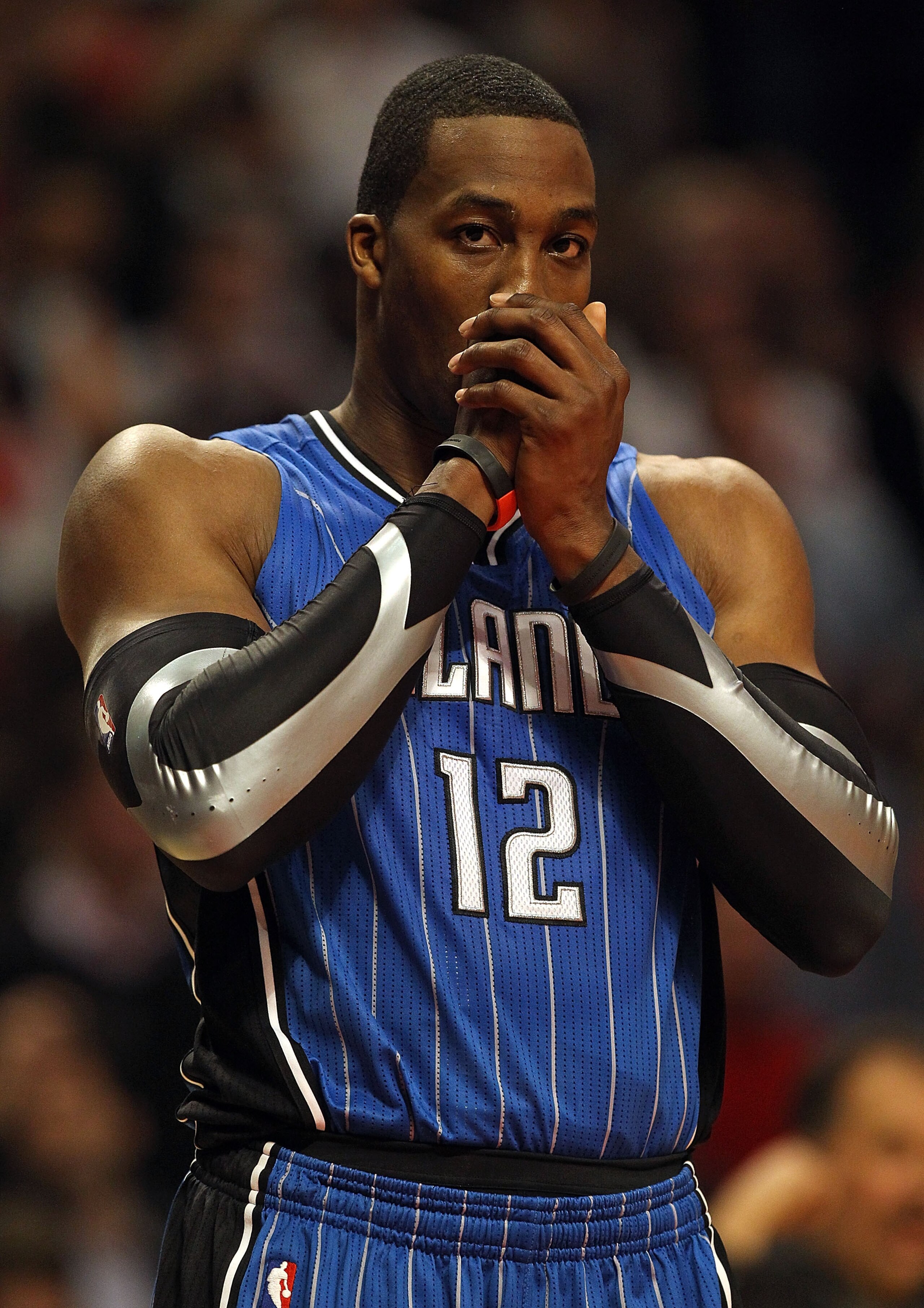 CHICAGO, IL - JANUARY 28: Dwight Howard #12 of the Orlando Magic warms his hands on the line during a game against the Chicago Bulls at the United Center on January 28, 2011 in Chicago, Illinois. The Bulls defeated the Magic 99-90. NOTE TO USER: User expr