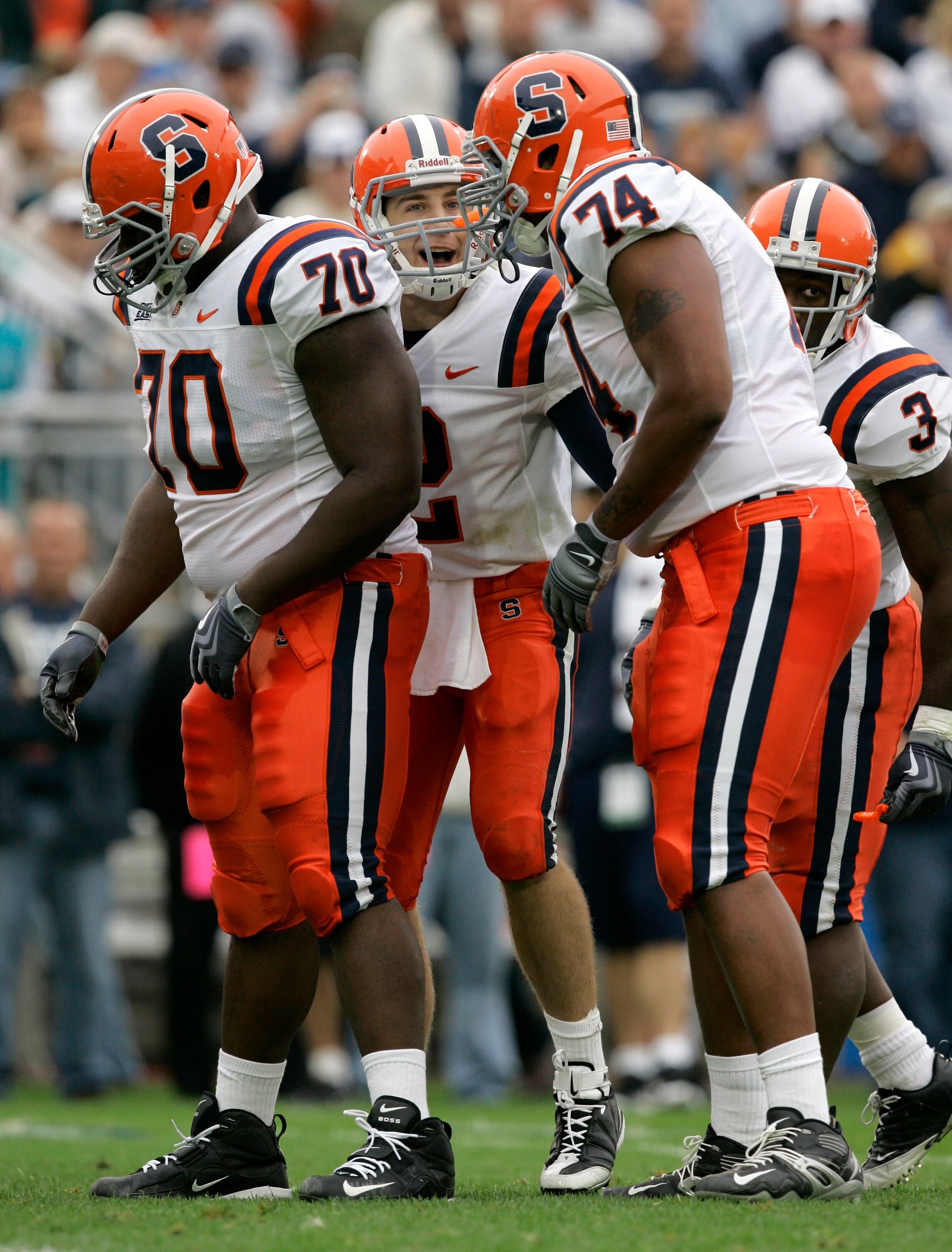 STATE COLLEGE, PA - SEPTEMBER 12: Quarterback Greg Paulus #2 of the Syracuse Orangemen shouts to his linemen Ryan Bartholomew #70, Nick Speller #74, and running back Delone Carter #3 during the second half against the Penn State Nittany Lions at Beaver St