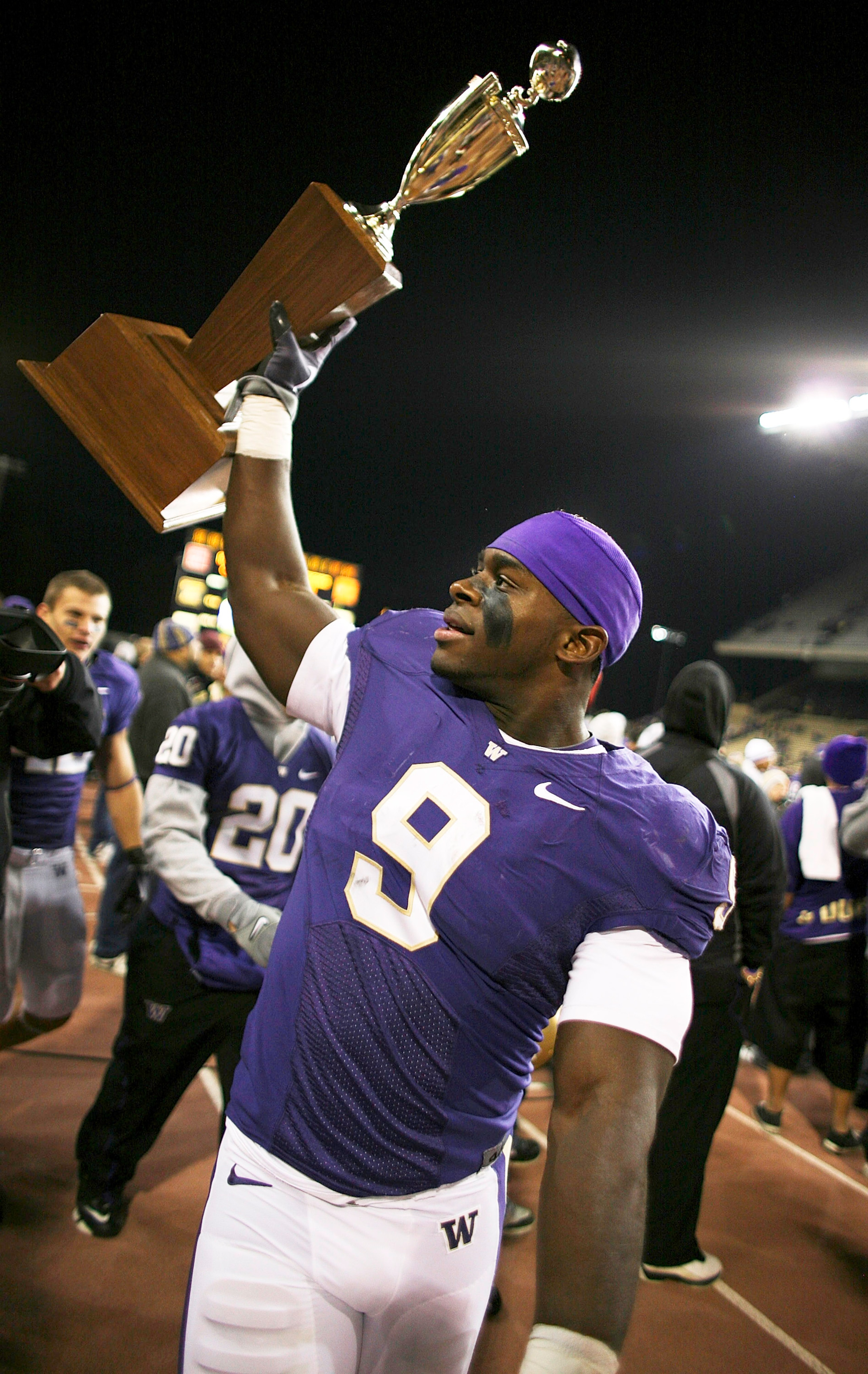 SEATTLE - NOVEMBER 28:  Linebacker Donald Butler #9 of the Washington Huskies holds the Apple Cup Trophy after defeating the Washington State Cougars 30-0 on November 28, 2009 at Husky Stadium in Seattle, Washington. (Photo by Otto Greule Jr/Getty Images)