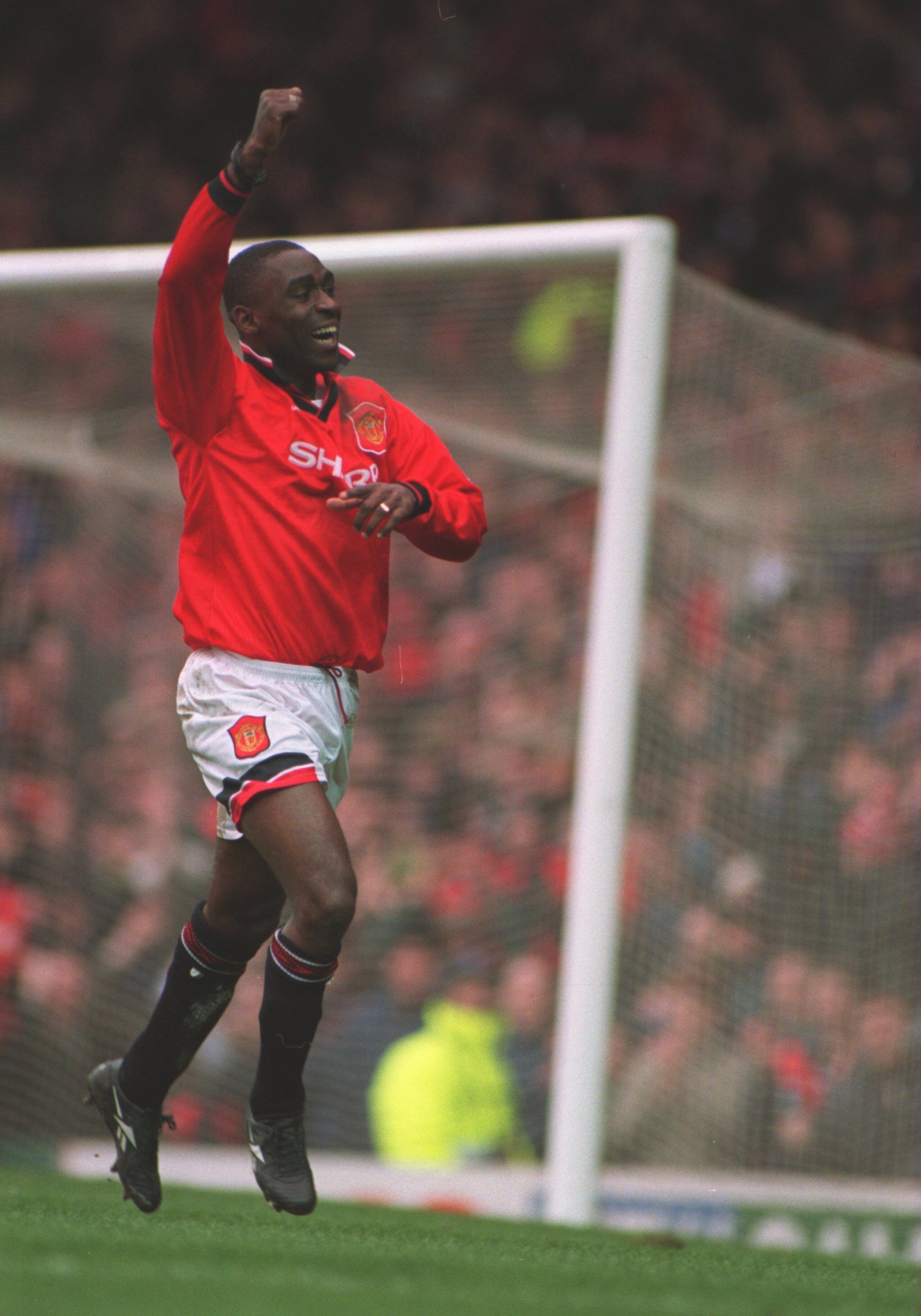 4 MAR 1995:  ANDY COLE OF MANCHESTER UNITED CELEBRATES AFTER SCORING HIS HAT TRICK FOR MAN UTD DURING THEIR 9-0 VICTORY OVER IPSWICH TOWN IN THE FA PREMIERSHIP MATCH AT OLD TRAFFORD, MANCHESTER. Mandatory Credit: Anton Want/ALLSPORT