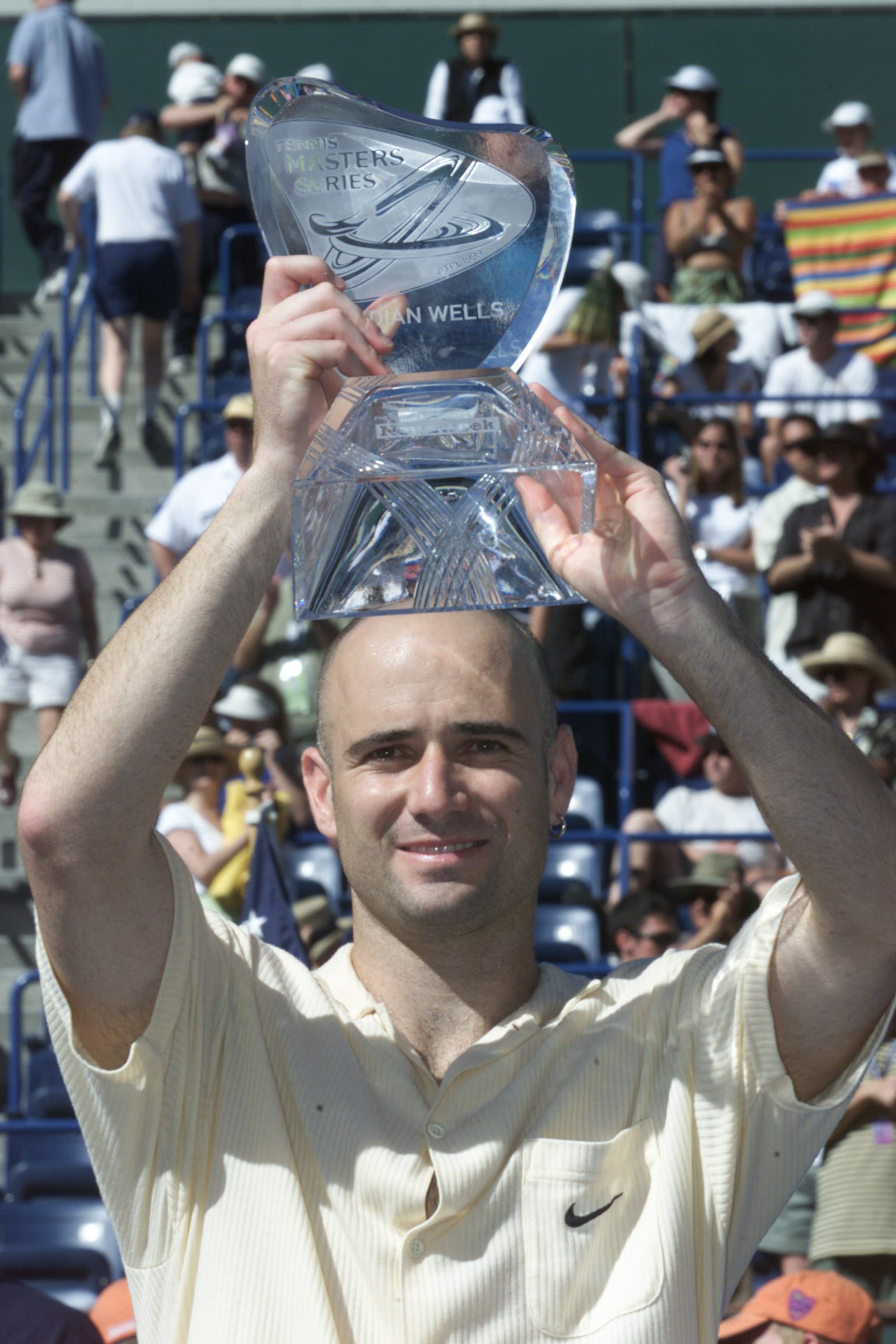 18 Mar 2001:  Andre Agassi of the USA holds the championship trophy after defeating Pete Sampras of the USA during the final of the Tennis Masters Series at Indian Wells, California. DIGITAL IMAGE Mandatory Credit: Jed Jacobsohn/ALLSPORT