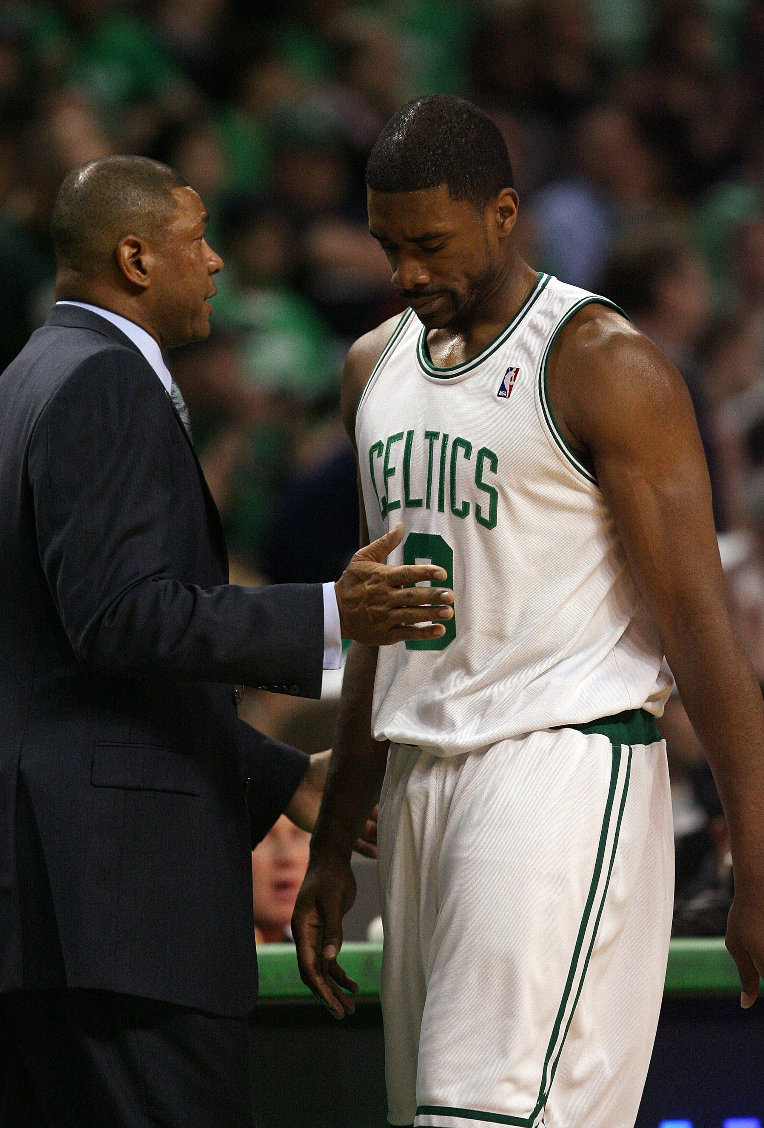 BOSTON - APRIL 18:  Head coach Doc Rivers of the Boston Celtics consoles Leon Powe #0 in the second half against the Chicago Bulls in Game One of the Eastern Conference Quarterfinals during the 2009 NBA Playoffs at TD Banknorth Garden on April 18, 2009 in