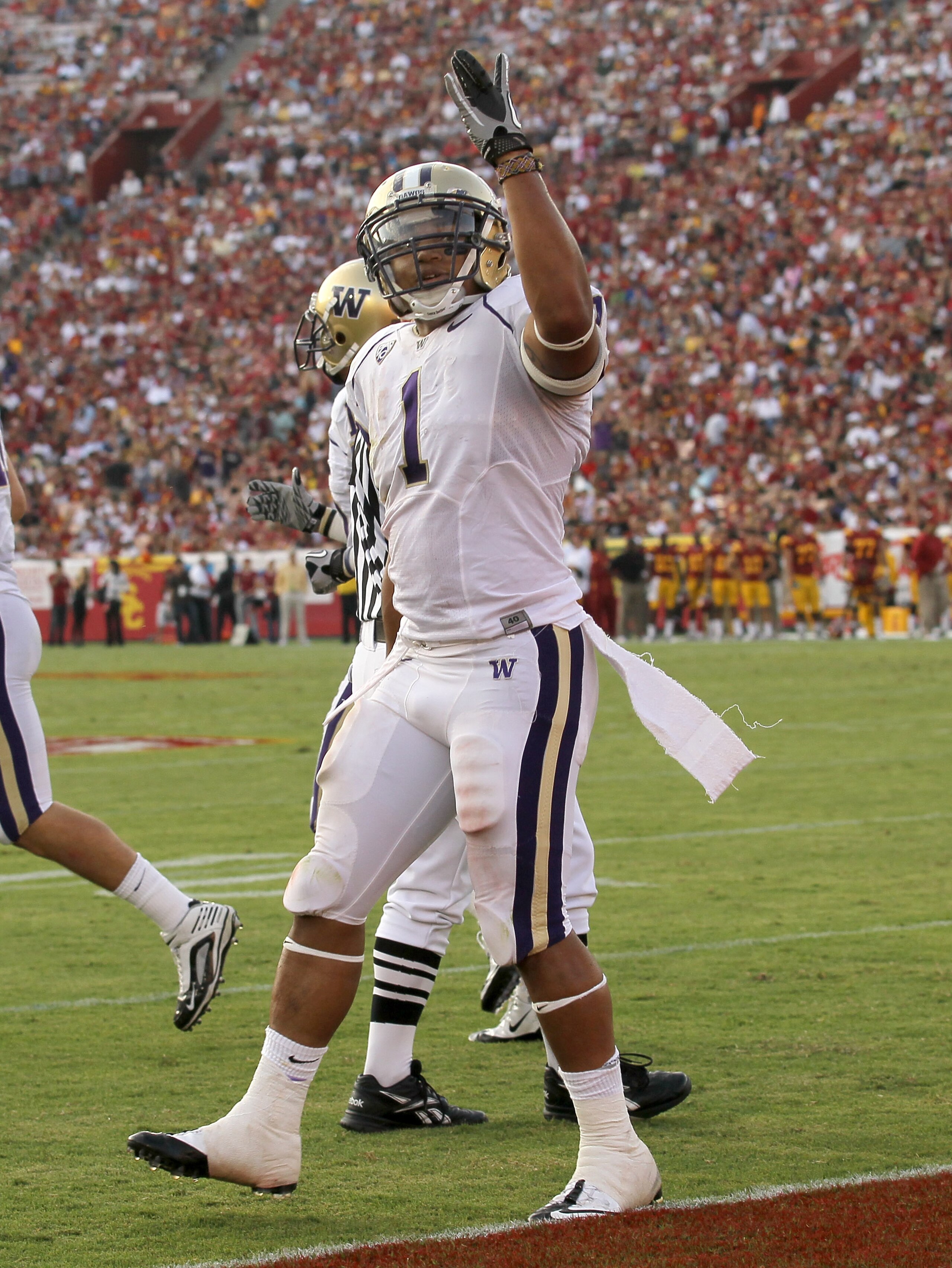 LOS ANGELES, CA - OCTOBER 02:  Running back Chris Polk #1  of the Washington Huskies celebrates his second quarter touchdown against the USC Trojans at the Los Angeles Memorial Coliseum on October 2, 2010 in Los Angeles, California.  Washington won 32-31.