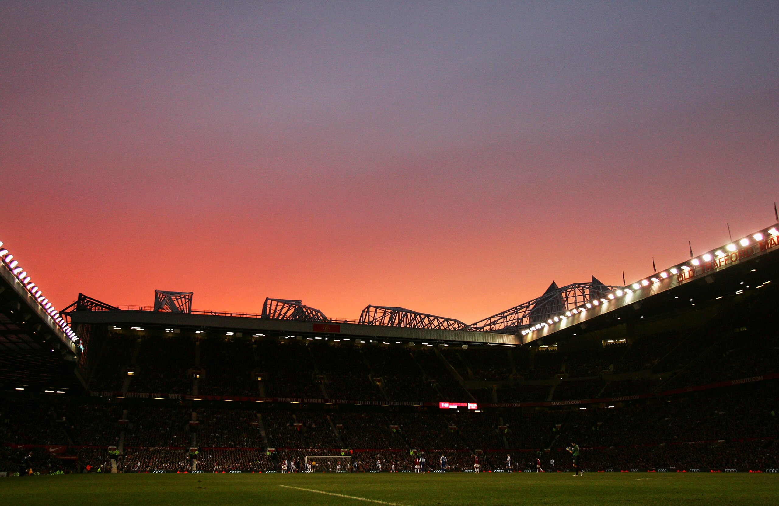 MANCHESTER, UNITED KINGDOM - FEBRUARY 17: General view as the sun dips behind the Stretford end during the FA Cup sponsored by E.ON Fifth Round match between Manchester United and Reading at Old Trafford on February 17, 2007 in Manchester, England. (Photo