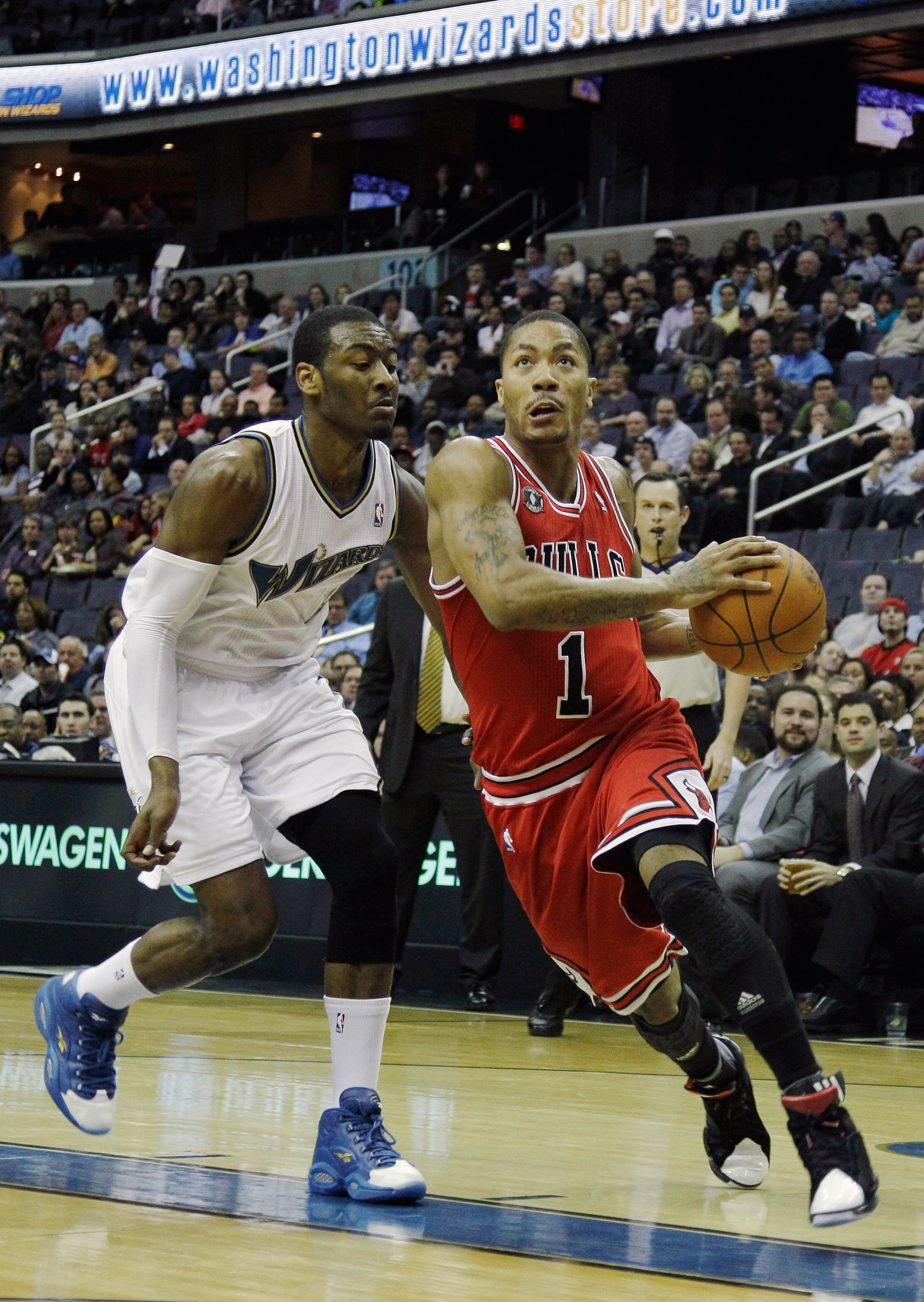 WASHINGTON, DC - FEBRUARY 28: Derrick Rose #1 of the Chicago Bulls drives to the basket while being guarded by John Wall #2 of the Washington Wizardsat the Verizon Center in Washington on February 28, 2011 in Washington, DC. NOTE TO USER: User expressly a WASHINGTON, DC - FEBRUARY 28: Derrick Rose #1 of the Chicago Bulls drives to the basket while being guarded by John Wall #2 of the Washington Wizardsat the Verizon Center in Washington on February 28, 2011 in Washington, DC. NOTE TO USER: User expressly a