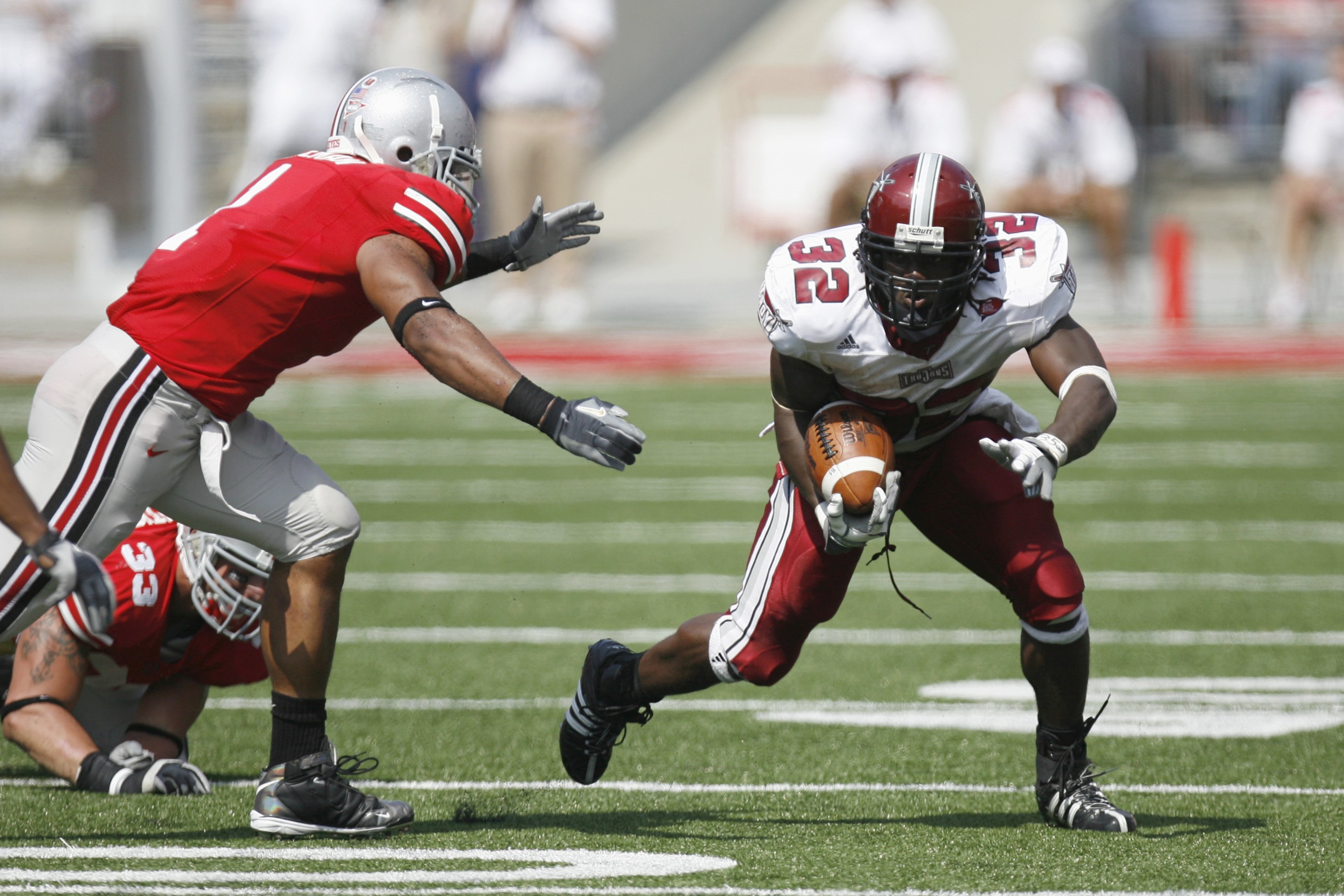 COLUMBUS, OH - SEPTEMBER 20: DuJuan Harris #32 of the Troy Trojans carries the ball during the game against the Ohio State Buckeyes on September 20, 2008 at Ohio Stadium in Columbus, Ohio. Ohio State won the game 28-10. (Photo by Gregory Shamus/Getty Ima COLUMBUS, OH - SEPTEMBER 20: DuJuan Harris #32 of the Troy Trojans carries the ball during the game against the Ohio State Buckeyes on September 20, 2008 at Ohio Stadium in Columbus, Ohio. Ohio State won the game 28-10. (Photo by Gregory Shamus/Getty Ima