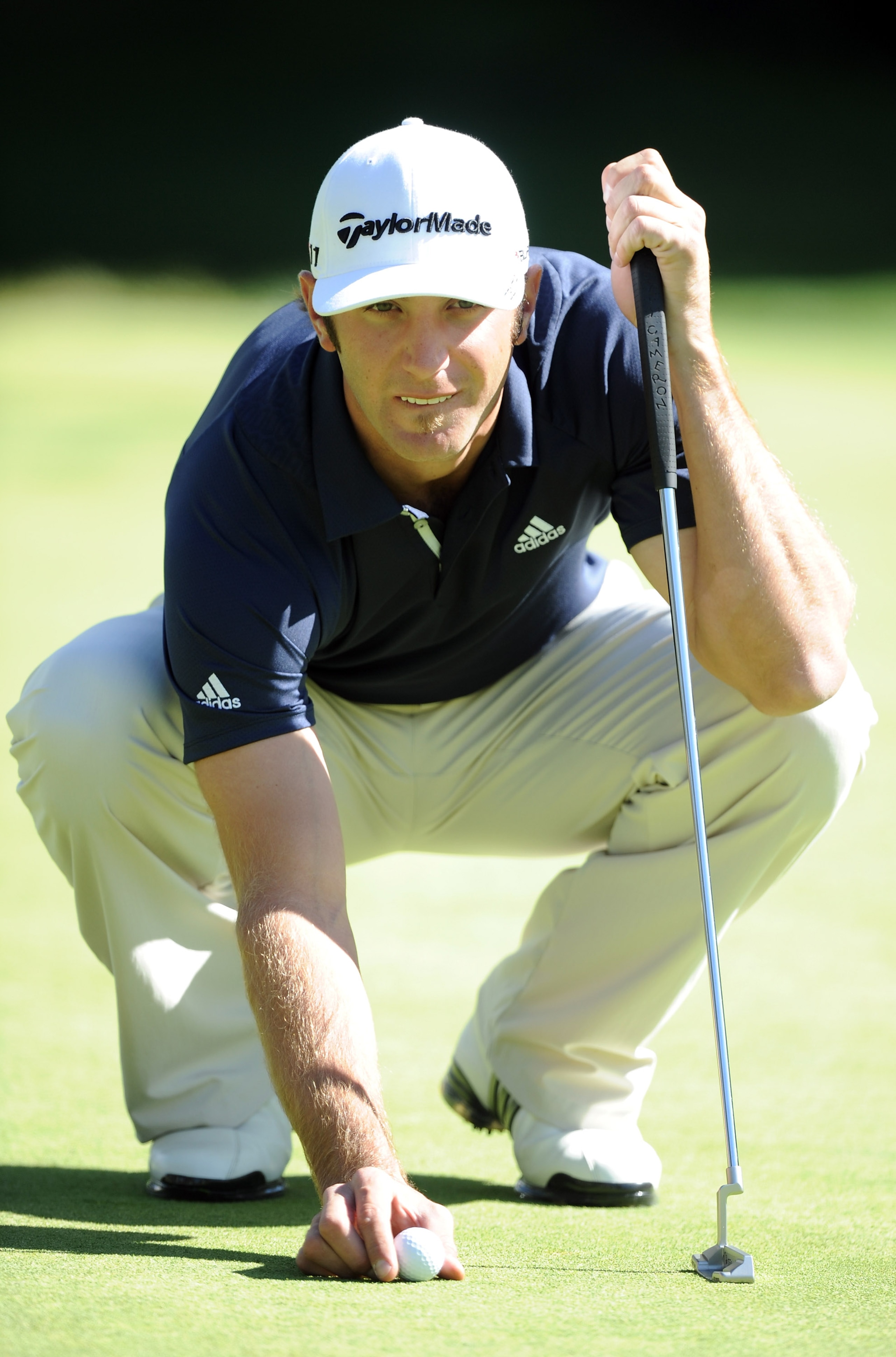 PACIFIC PALISADES, CA - FEBRUARY 17:  Dustin Johnson lines up his putt on the 12th green during the Northern Trust Open at the Riviera Country Club on February 17, 2011 in Pacific Palisades, California.  (Photo by Harry How/Getty Images)