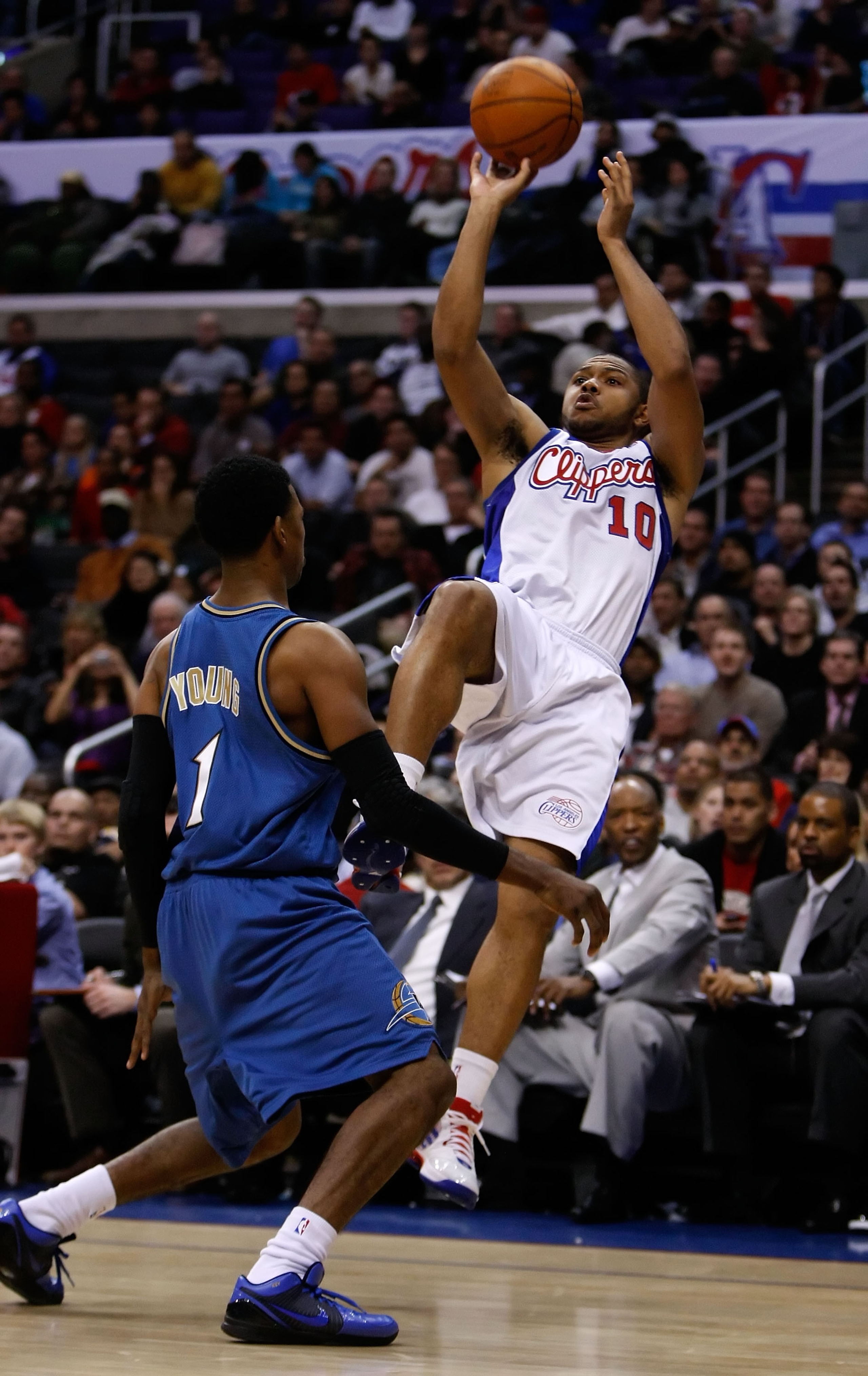 LOS ANGELES, CA - DECEMBER 14: Eric Gordon #10 of the Los Angeles Clippers shoots over Nick Young #1 of the Washington Wizards in the second half at Staples Center on December 14, 2009 in Los Angeles, California. The Clippers defeated the Wizards 97-95. LOS ANGELES, CA - DECEMBER 14: Eric Gordon #10 of the Los Angeles Clippers shoots over Nick Young #1 of the Washington Wizards in the second half at Staples Center on December 14, 2009 in Los Angeles, California. The Clippers defeated the Wizards 97-95.