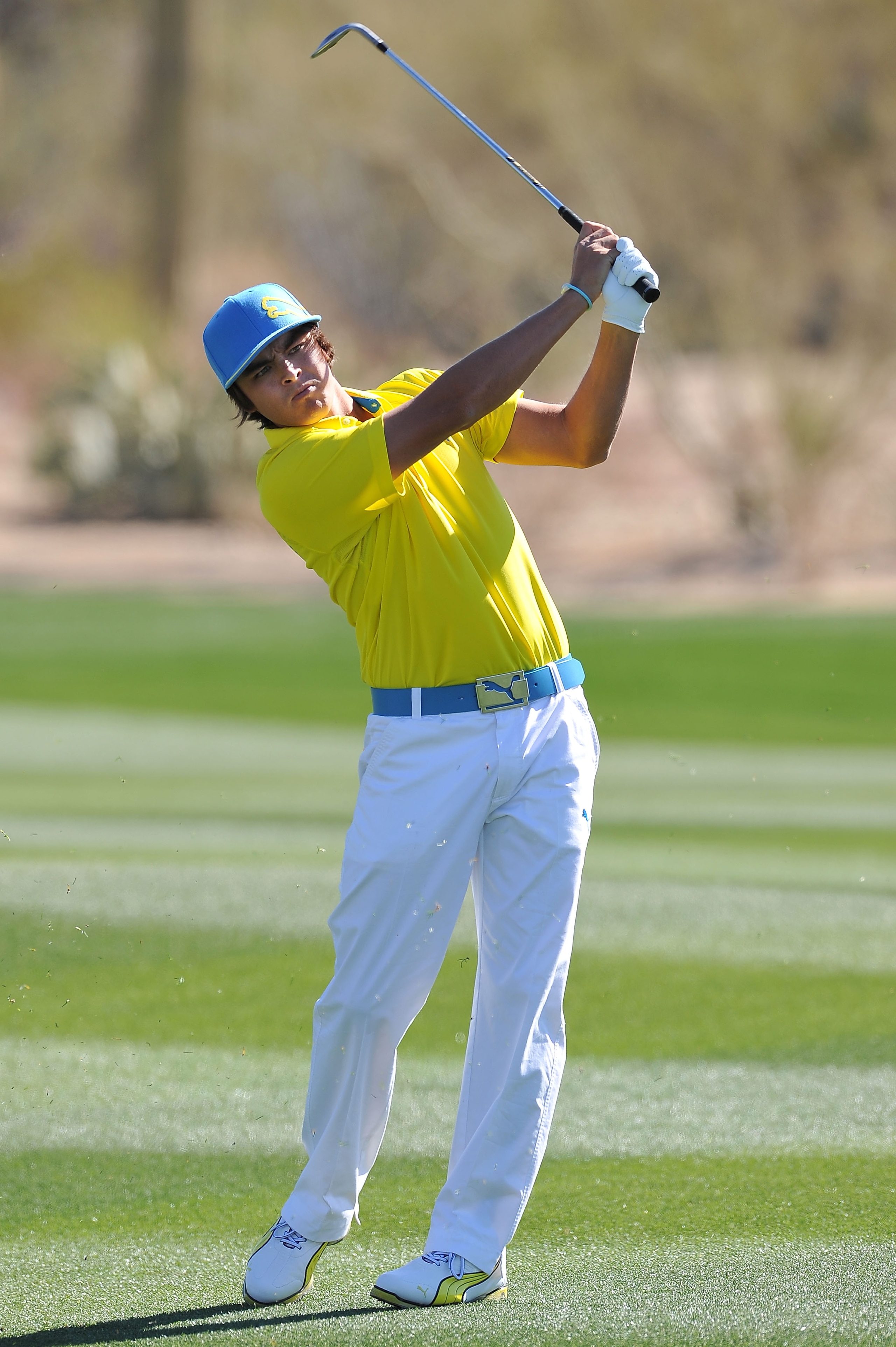 MARANA, AZ - FEBRUARY 25:  Rickie Fowler hits an approach shot on the first hole during the third round of the Accenture Match Play Championship at the Ritz-Carlton Golf Club on February 25, 2011 in Marana, Arizona.  (Photo by Stuart Franklin/Getty Images