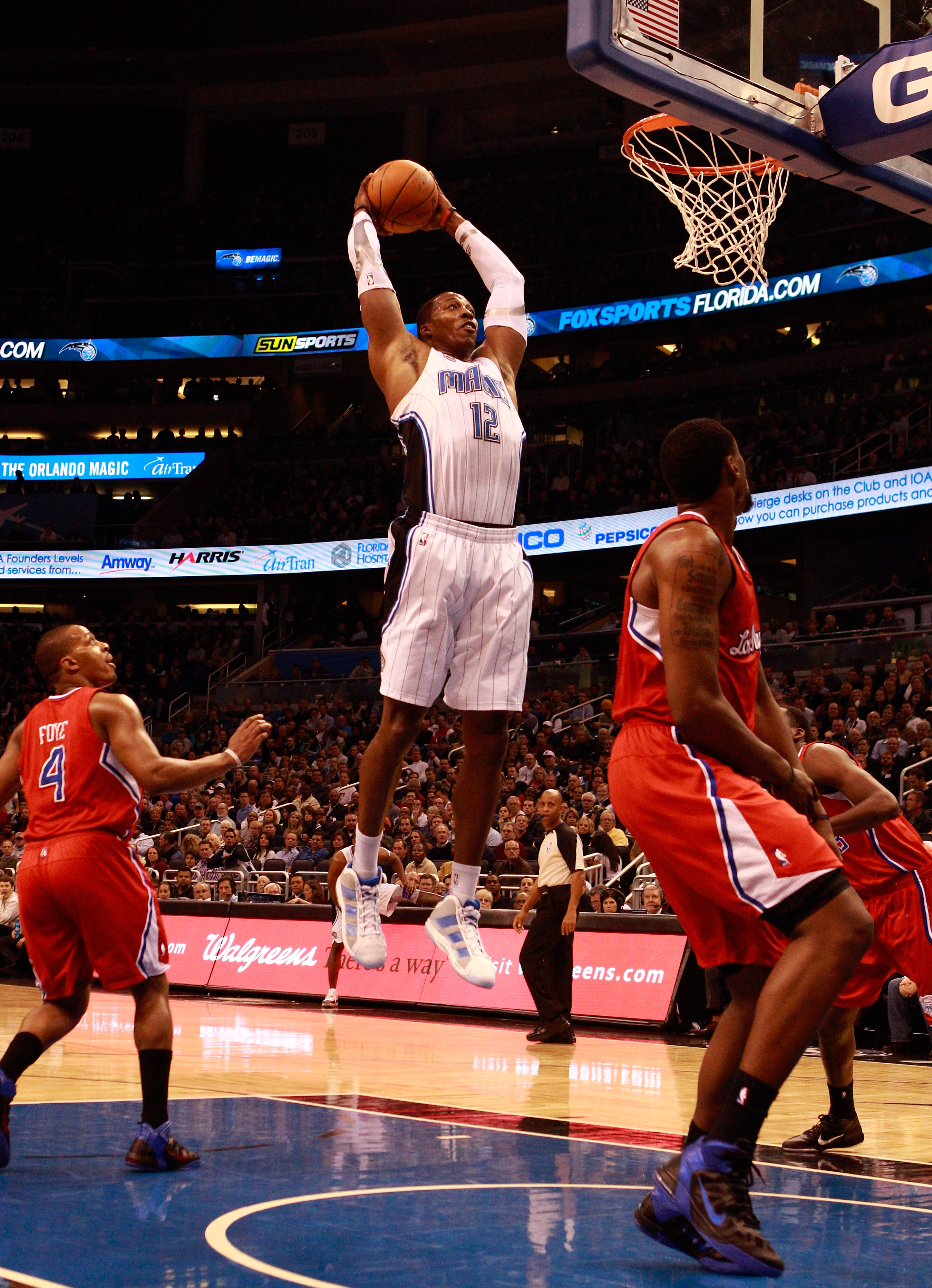 ORLANDO, FL - FEBRUARY 08: Dwight Howard #12 of the Orlando Magic attempts a shot during a game against the Los Angeles Clippers at Amway Arena on February 8, 2011 in Orlando, Florida. NOTE TO USER: User expressly acknowledges and agrees that, by downlo ORLANDO, FL - FEBRUARY 08: Dwight Howard #12 of the Orlando Magic attempts a shot during a game against the Los Angeles Clippers at Amway Arena on February 8, 2011 in Orlando, Florida. NOTE TO USER: User expressly acknowledges and agrees that, by downlo