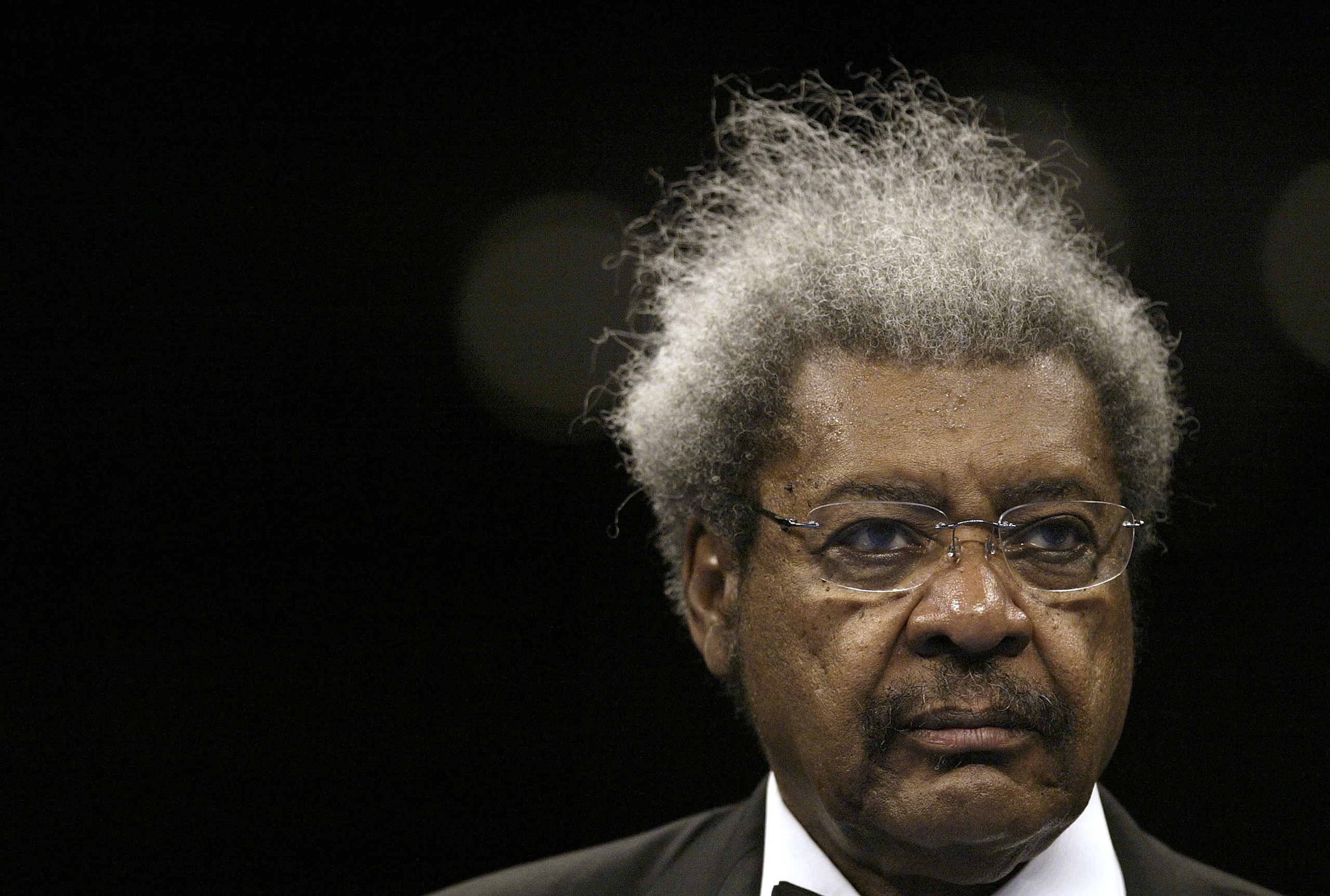 ST. LOUIS - JULY 8:  Promoter Don King looks on before the IBF junior middleweight title bout between Roman Karmazin and Cory Spinks on July 8, 2006 at the Savvis Center in St. Louis, Missouri. Spinks won the title by getting a majority decision over Karm