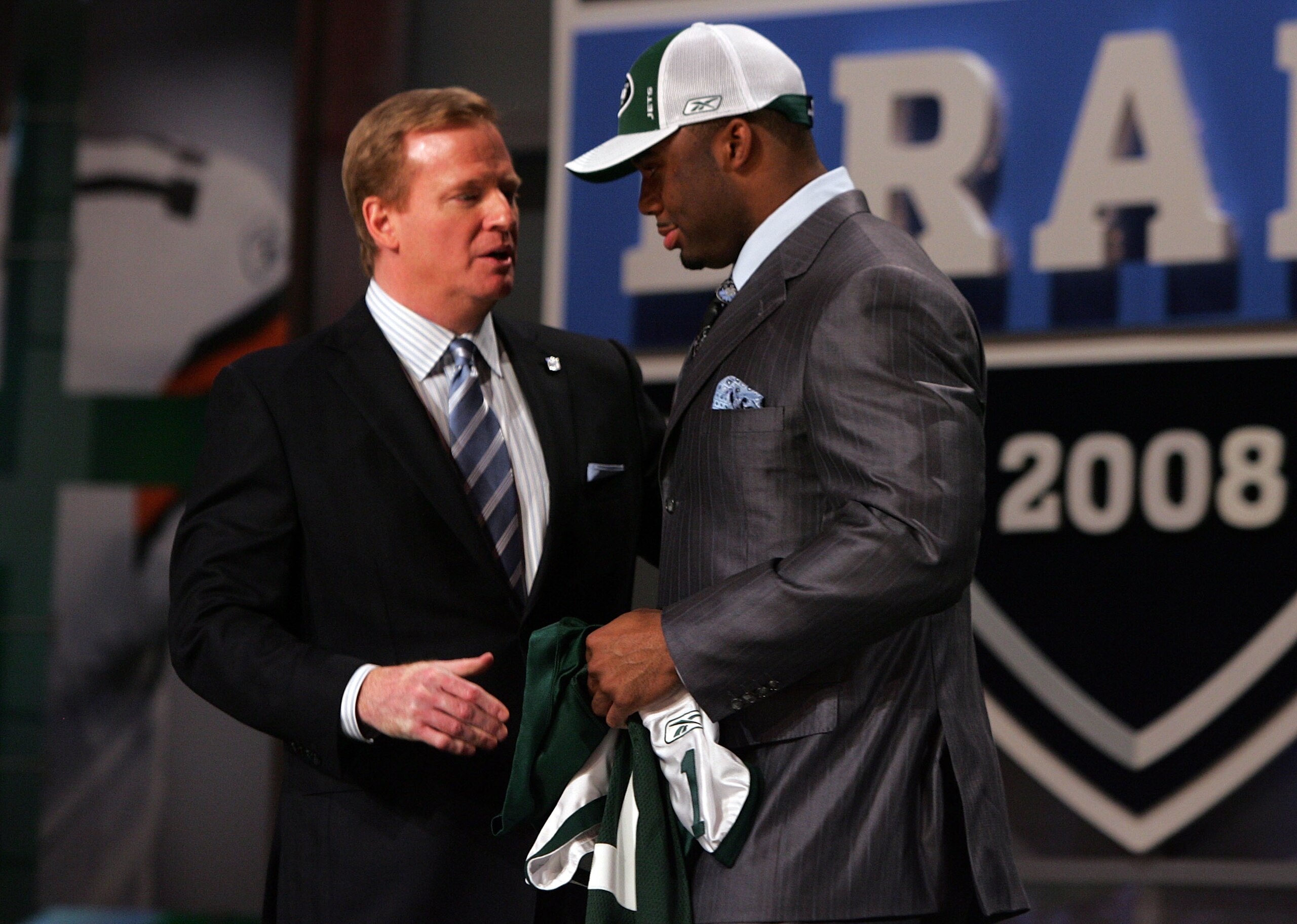 NEW YORK - APRIL 26: Vernon Gholston talks with National Football League Commissioner Roger Goodell after being selected as the sixth overall pick by the New York Jets during the 2008 NFL Draft on April 26, 2008 at Radio City Music Hall in New York, New NEW YORK - APRIL 26: Vernon Gholston talks with National Football League Commissioner Roger Goodell after being selected as the sixth overall pick by the New York Jets during the 2008 NFL Draft on April 26, 2008 at Radio City Music Hall in New York, New