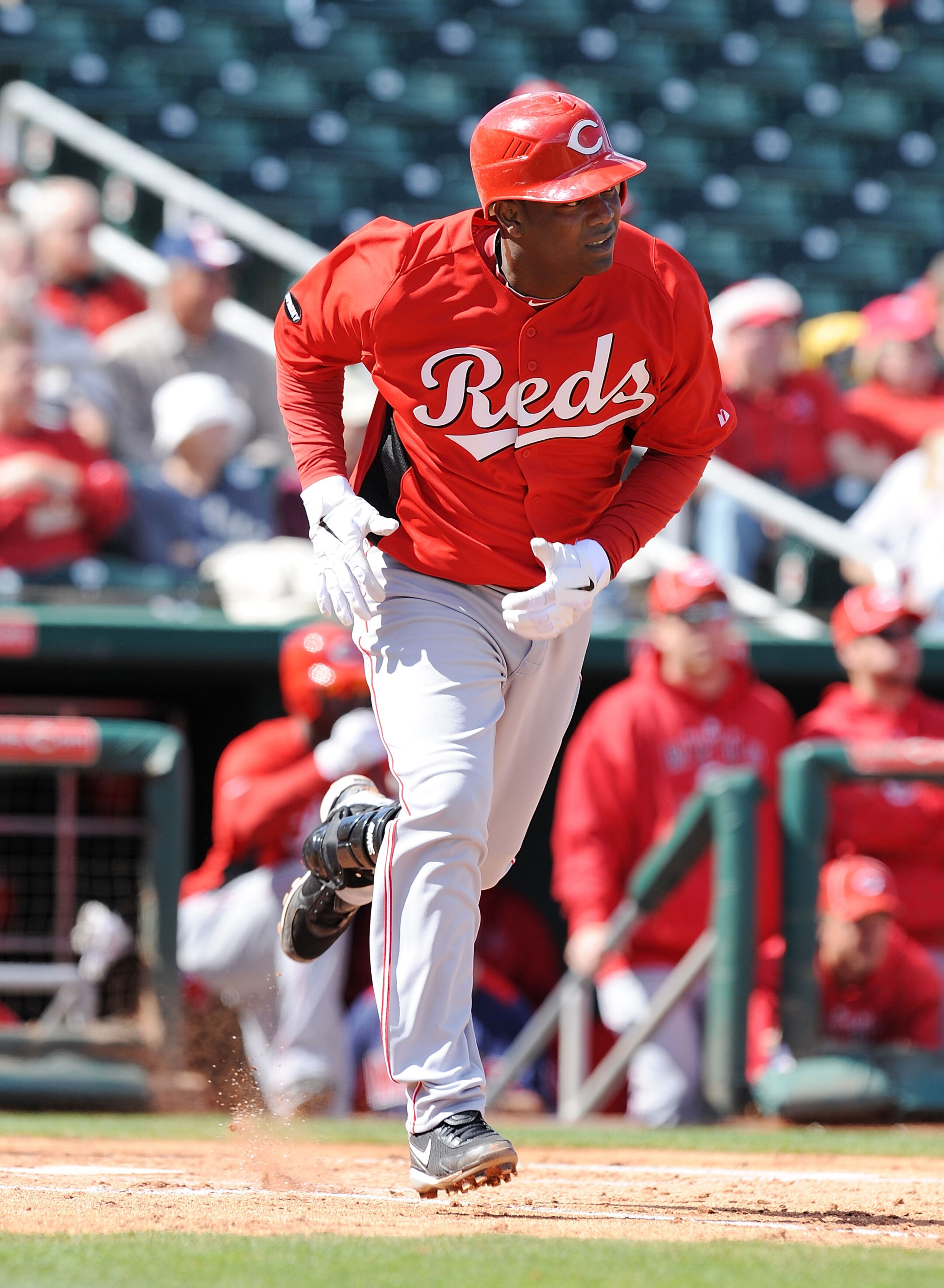GOODYEAR, AZ - FEBRUARY 27:  Edgar Renteria #16 of the Cincinnati Reds runs out a hit against the Cleveland Indians at Goodyear Ballpark on February 27, 2011 in Goodyear, Arizona.  (Photo by Norm Hall/Getty Images)
