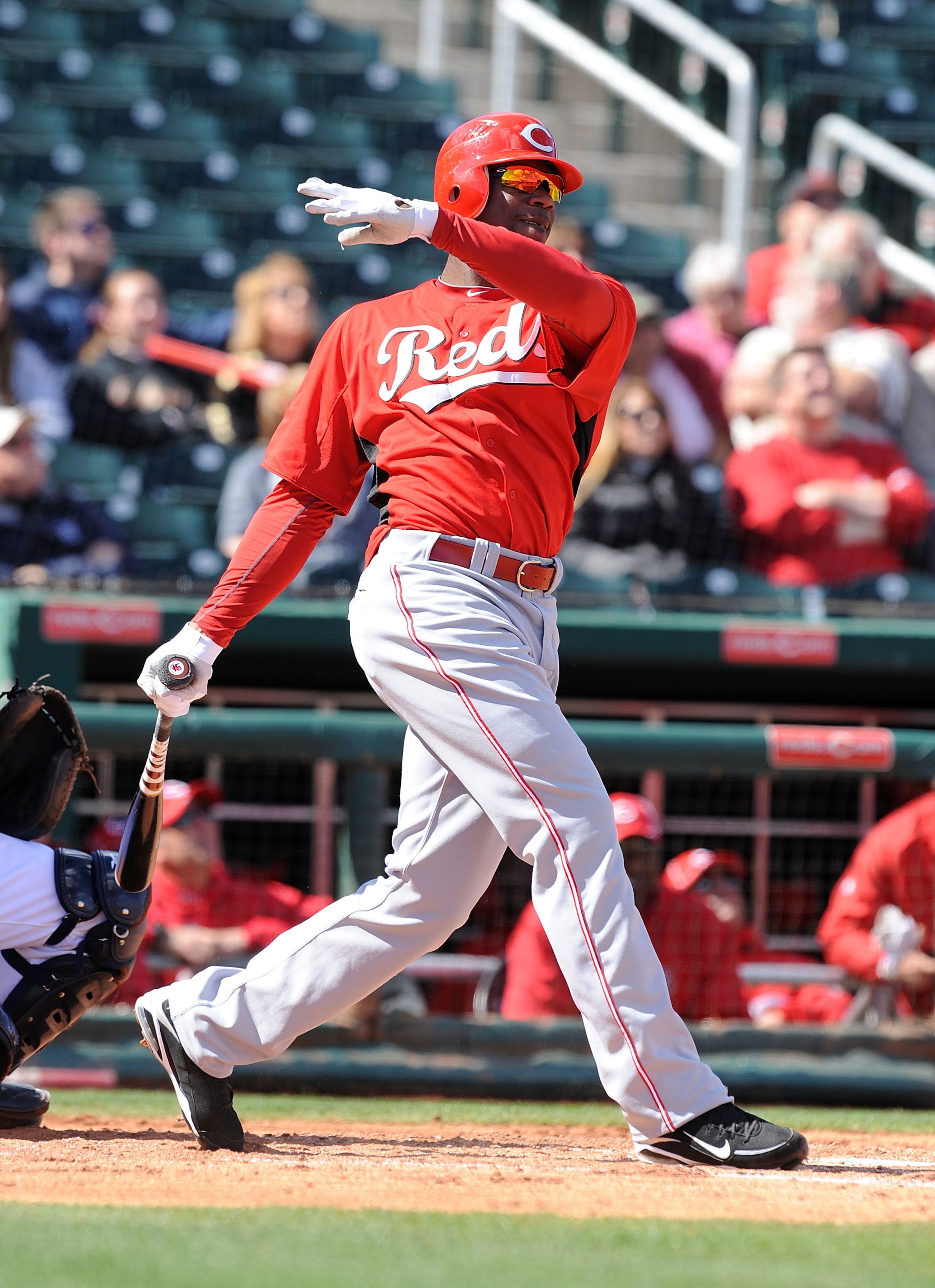 GOODYEAR, AZ - FEBRUARY 27:  Fred Lewis #15 of the Cincinnati Reds follows through on a swing against the Cleveland Indians at Goodyear Ballpark on February 27, 2011 in Goodyear, Arizona.  (Photo by Norm Hall/Getty Images)