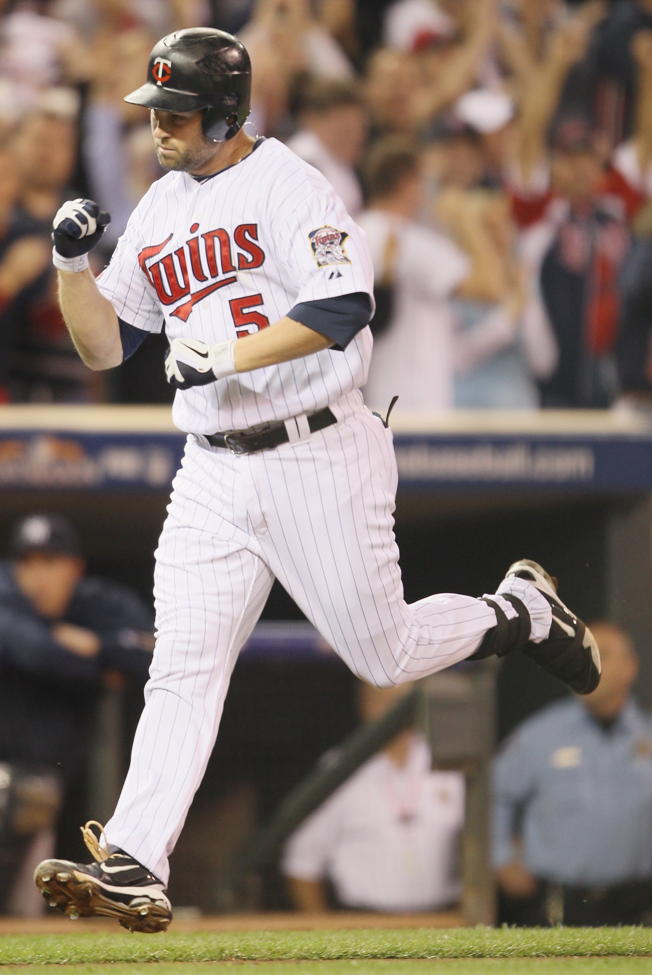 MINNEAPOLIS - OCTOBER 06: Michael Cuddyer #5 of the Minnesota Twins celebrates his two run homer against the New York Yankees during game one of the ALDS on October 6, 2010 at Target Field in Minneapolis, Minnesota. (Photo by Elsa/Getty Images) MINNEAPOLIS - OCTOBER 06: Michael Cuddyer #5 of the Minnesota Twins celebrates his two run homer against the New York Yankees during game one of the ALDS on October 6, 2010 at Target Field in Minneapolis, Minnesota. (Photo by Elsa/Getty Images)