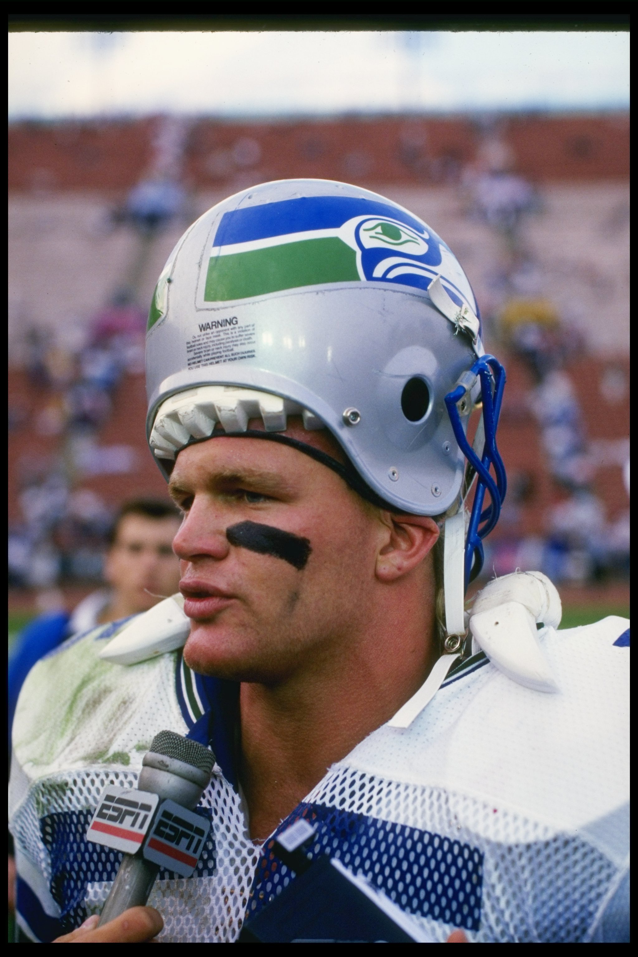 A close up of Brian Bosworth of the Seattle Seahawks as he looks on News  Photo - Getty Images