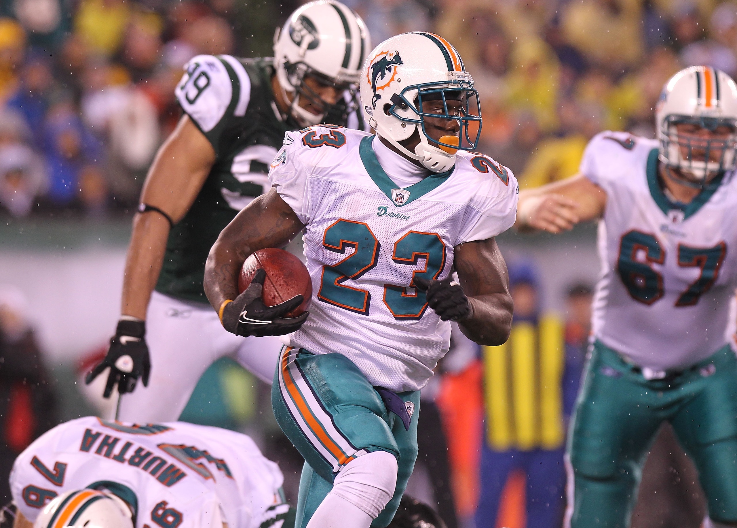 EAST RUTHERFORD, NJ - DECEMBER 12:  Ronnie Brown #23 of the Miami Dolphins rushes against the New York Jets at New Meadowlands Stadium on December 12, 2010 in East Rutherford, New Jersey.  (Photo by Nick Laham/Getty Images)