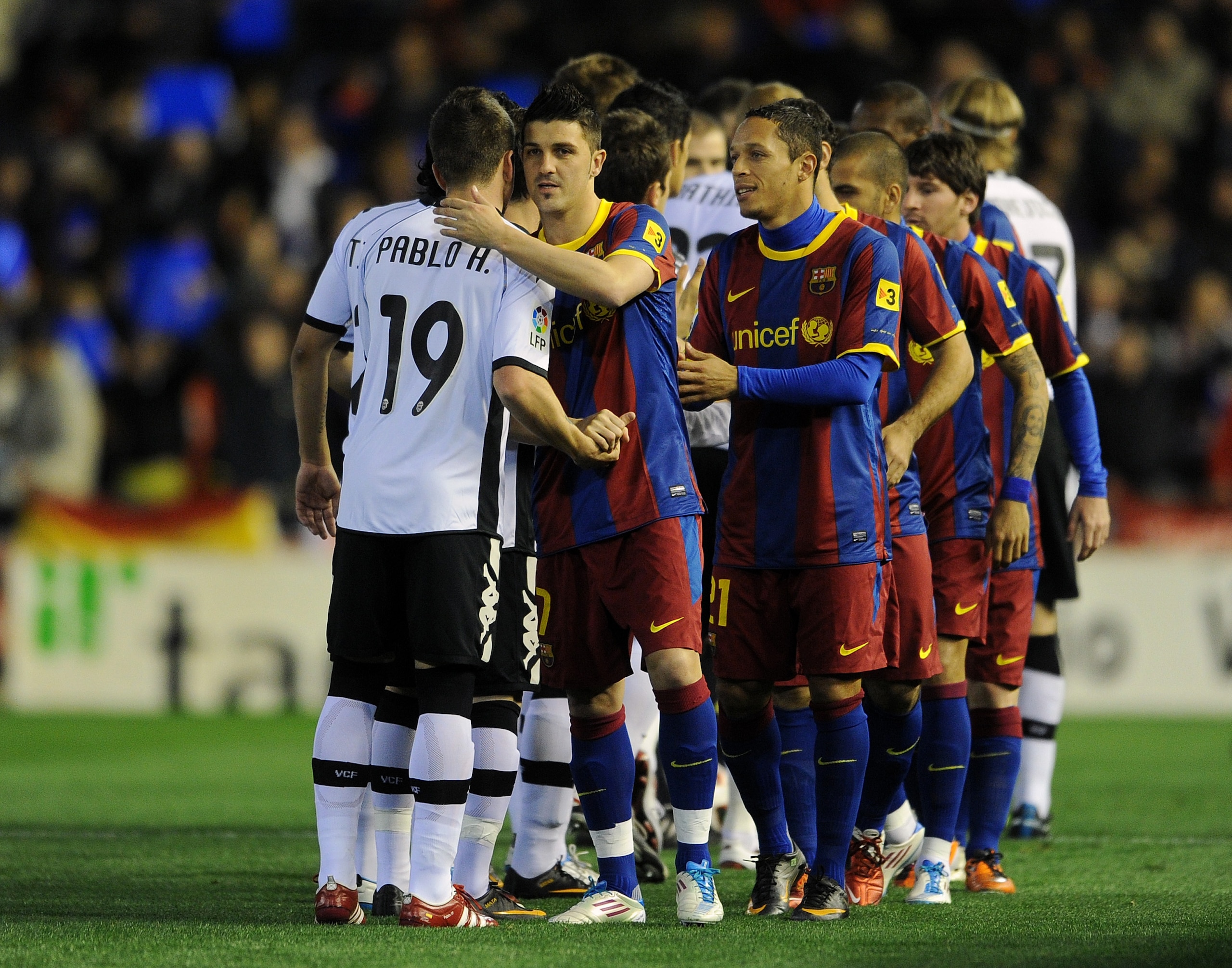 VALENCIA, SPAIN - MARCH 02: Former Valencia player David Villa (R) of Barcelona greets his old teammate Pablo Hernandez of Valencia during the la Liga match between Valencia and Barcelona at Estadio Mestalla on March 2, 2011 in Valencia, Spain. (Photo b VALENCIA, SPAIN - MARCH 02: Former Valencia player David Villa (R) of Barcelona greets his old teammate Pablo Hernandez of Valencia during the la Liga match between Valencia and Barcelona at Estadio Mestalla on March 2, 2011 in Valencia, Spain. (Photo b