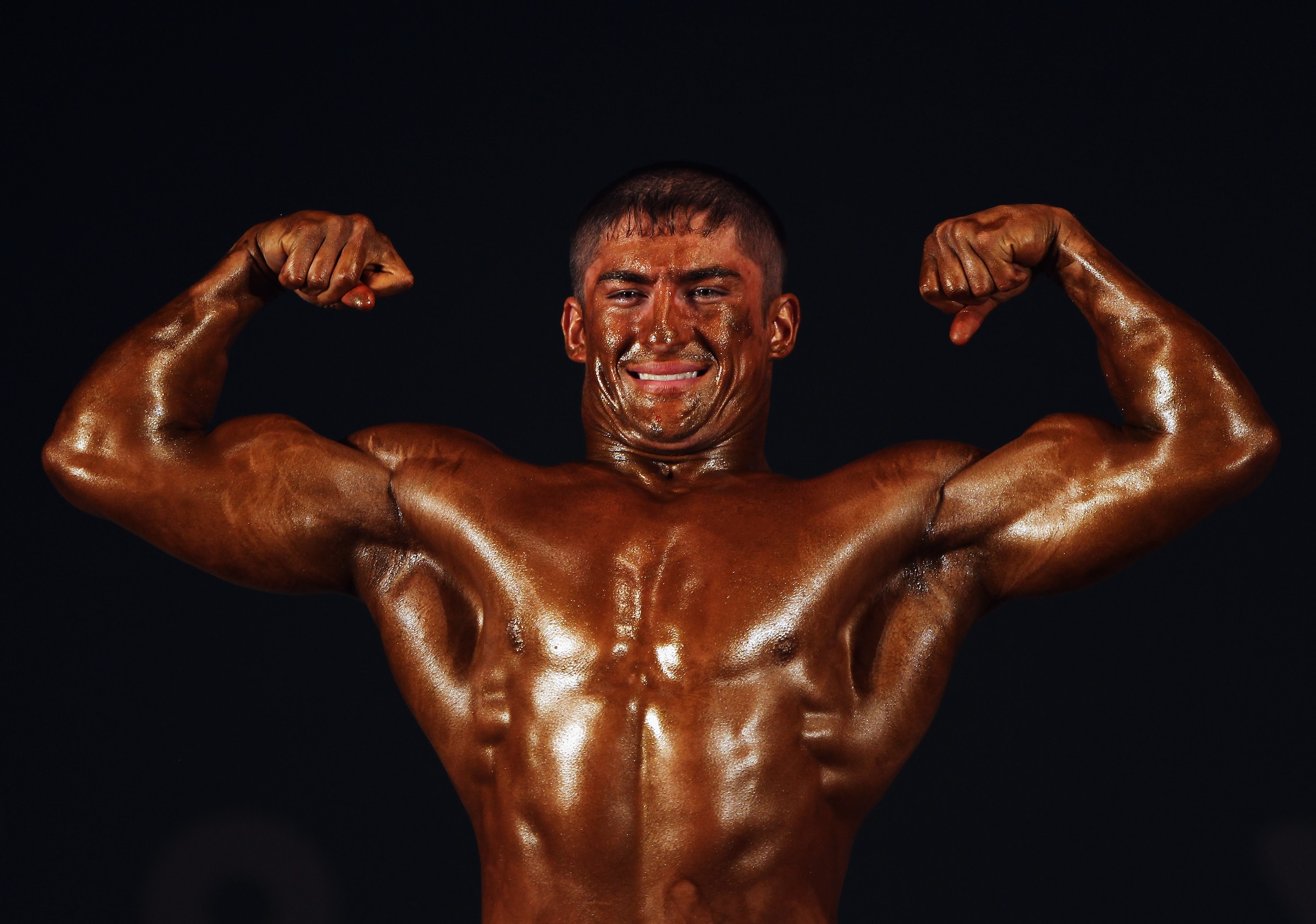 MUSCAT, OMAN - DECEMBER 11: Firuz Davlyatov of Tajikistan competes in the Bodybuilding event at Qurum Natural Park during day four of the 2nd Asian Beach Games Muscat 2010 on December 11, 2010 in Muscat, Oman. (Photo by Bryn Lennon/Getty Images) MUSCAT, OMAN - DECEMBER 11: Firuz Davlyatov of Tajikistan competes in the Bodybuilding event at Qurum Natural Park during day four of the 2nd Asian Beach Games Muscat 2010 on December 11, 2010 in Muscat, Oman. (Photo by Bryn Lennon/Getty Images)