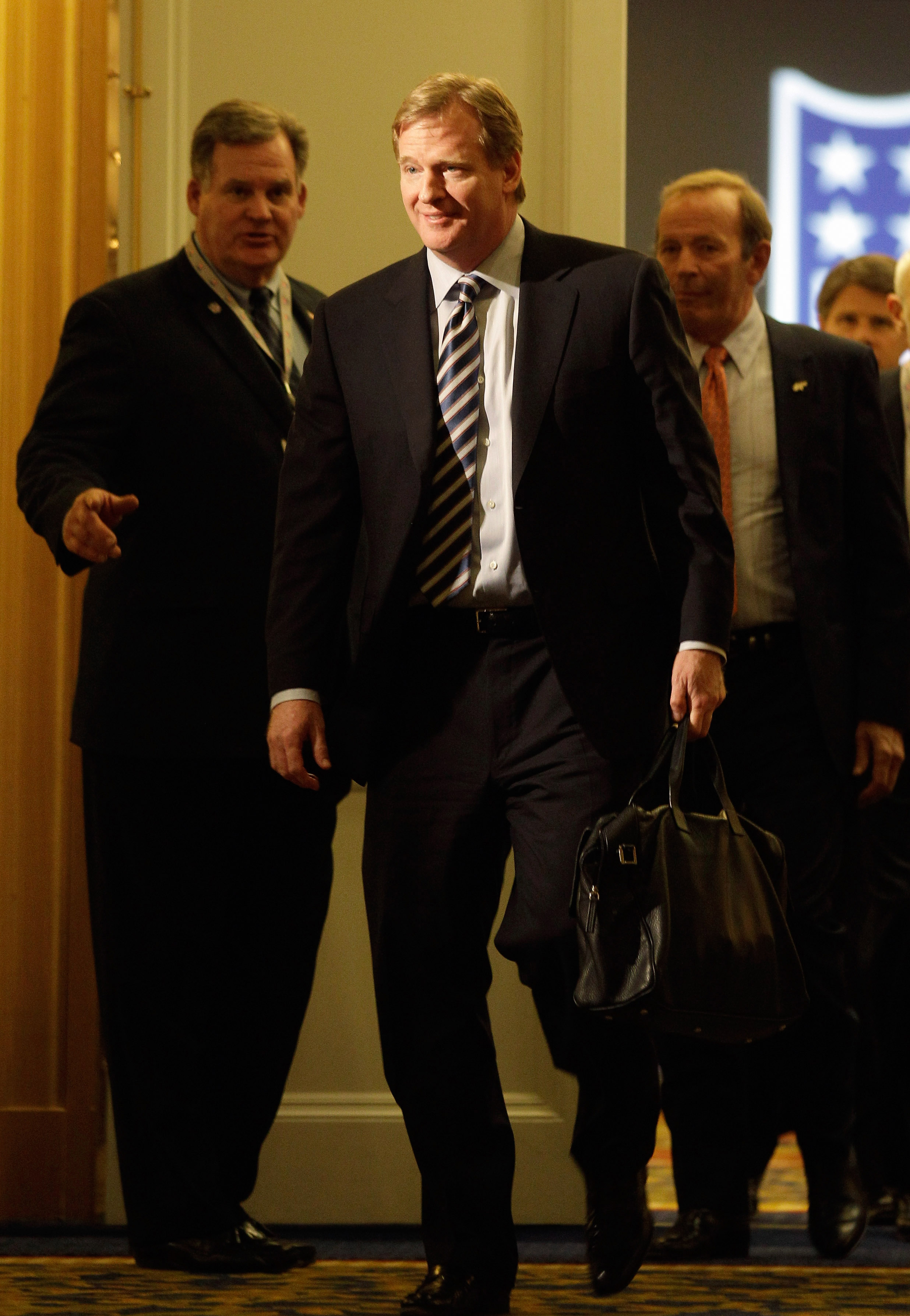 CHANTILLY, VA - MARCH 02:  NFL Commissioner Roger Goodell (C) leaves a meeting with NFL owners at a hotel on March 2, 2011 in Chantilly, Virginia. The NFL owners are meeting in Chantilly to discuss negotiations with the players union about a collective ba